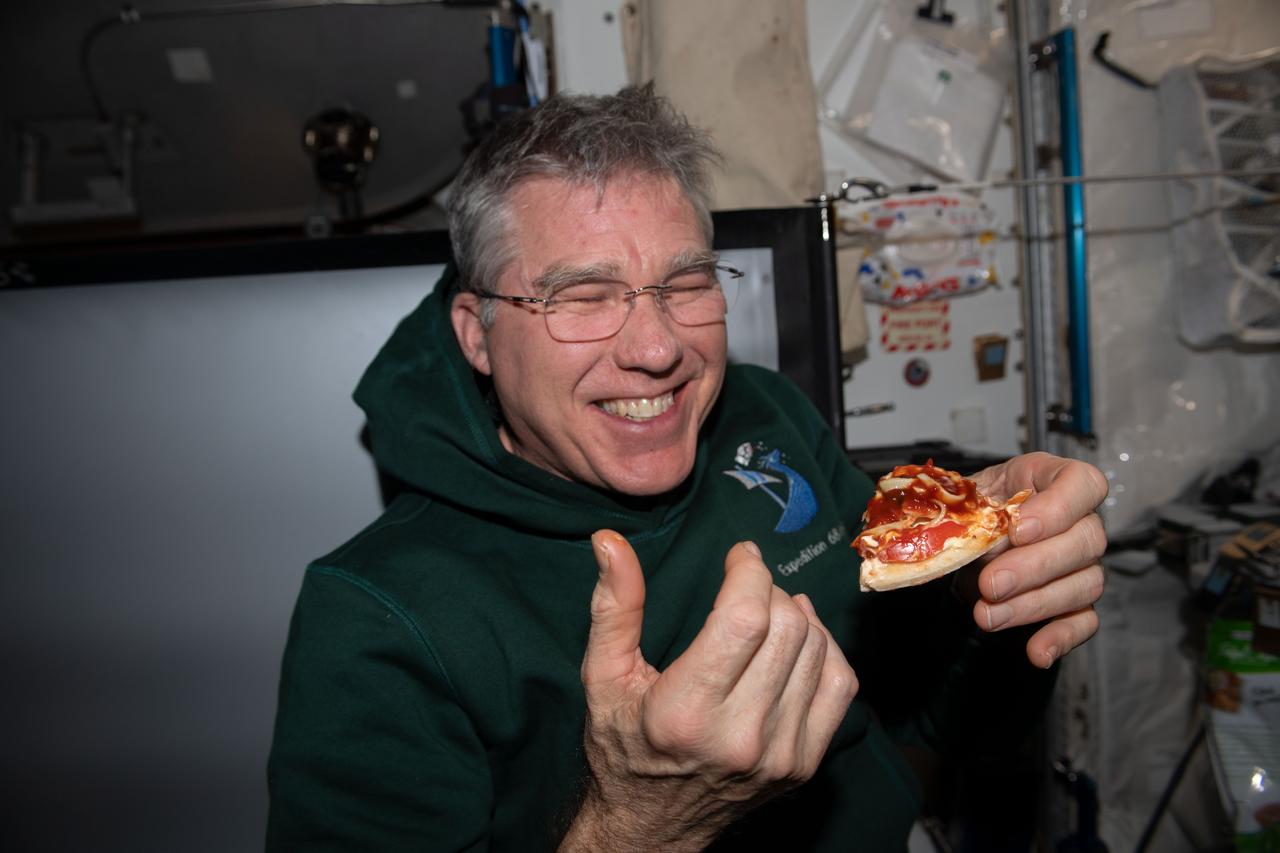 iss069e084176 (Aug. 26, 2023) --- NASA astronaut and Expedition 69 Flight Engineer Stephen Bowen is pictured in the International Space Station's Unity module during the always popular pizza night.