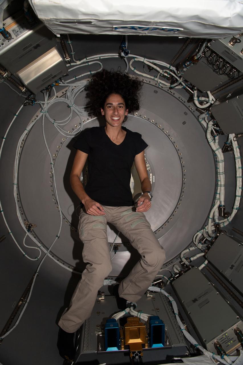 iss069e085981 (Sept. 5, 2023) --- NASA astronaut and Expedition 69 Flight Engineer Jasmin Moghbeli is pictured inside the NanoRacks Bishop airlock located on the port side of the International Space Station's Tranquility module. Bishop is a commercial doorway that can be robotically removed and attached to Tranquility and enables larger payloads to be moved inside and outside the station.