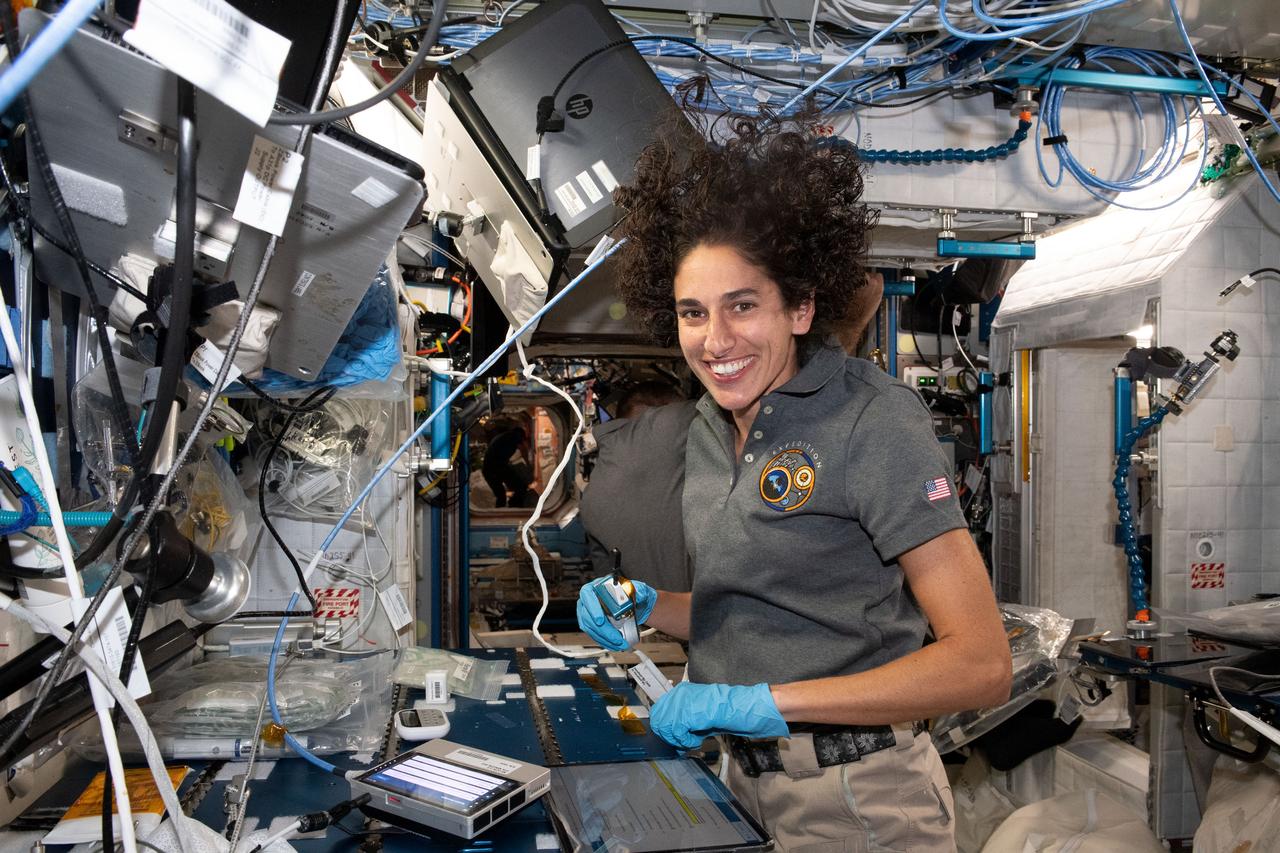 iss069e088431_alt (Sept. 15, 2023) --- NASA astronaut and Expedition 69 Flight Engineer Jasmin Moghbeli services microbe samples for DNA sequencing aboard the International Space Station.