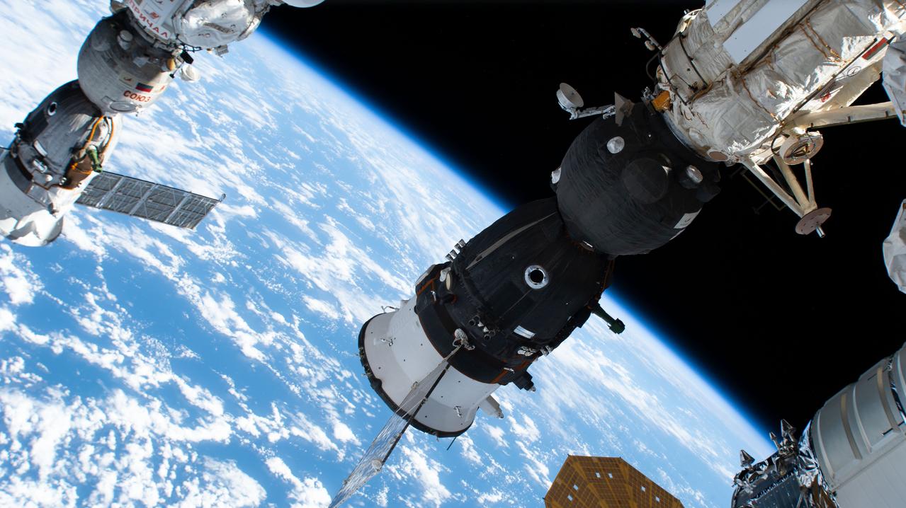 iss069e089047 (Sept. 18, 2023) --- The Soyuz MS-24 spacecraft that carried NASA astronaut Loral O'Hara and Roscosmos cosmonauts Oleg Kononenko and Nikolai Chub to the International Space Station is pictured docked to the Rassvet module. At far left, is the Soyuz MS-23 crew ship, docked to the Prichal docking module, that will return NASA astronaut Frank Rubio and Roscosmos cosmonauts Sergey Prokopyev and Dmitri Petelin back to Earth on Sept. 27.