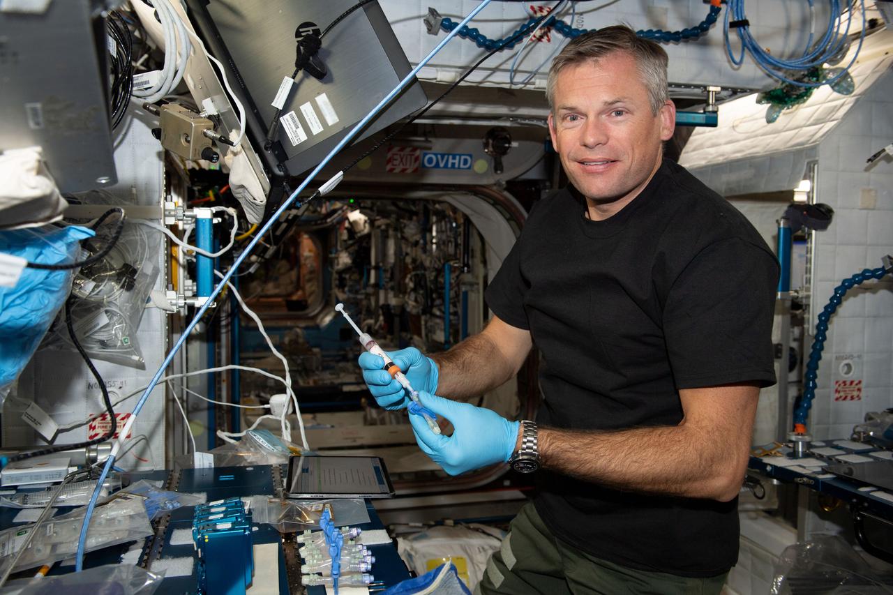 iss069e089106_alt (Sept. 18, 2023) --- ESA (European Space Agency) astronaut and Expedition 69 Flight Engineer Andreas Mogensen processes blood samples and prepares them for stowage inside a Kubik research incubator aboard the International Space Station.