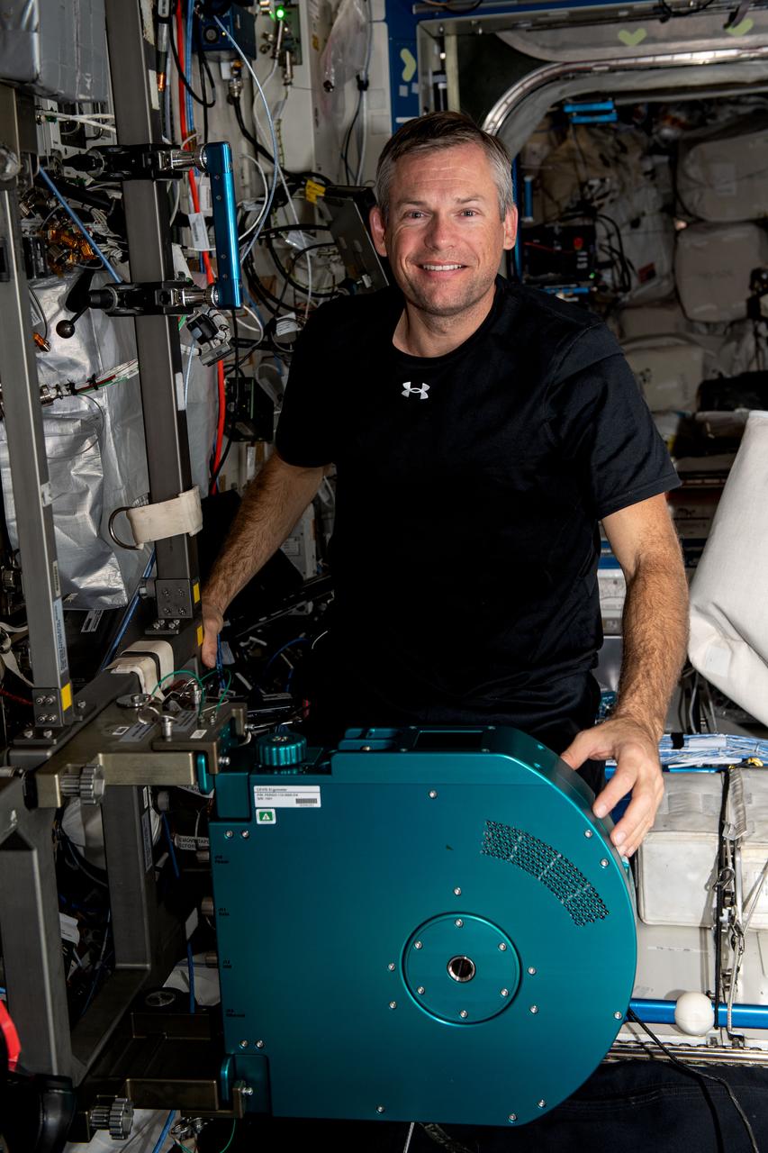 iss070e001677 (Oct. 3, 2023) --- ESA (European Space Agency) astronaut and Expedition 70 Commander Andreas Mogensen is pictured with the International Space Station's new exercise cycle after it was installed in the Destiny laboratory module.