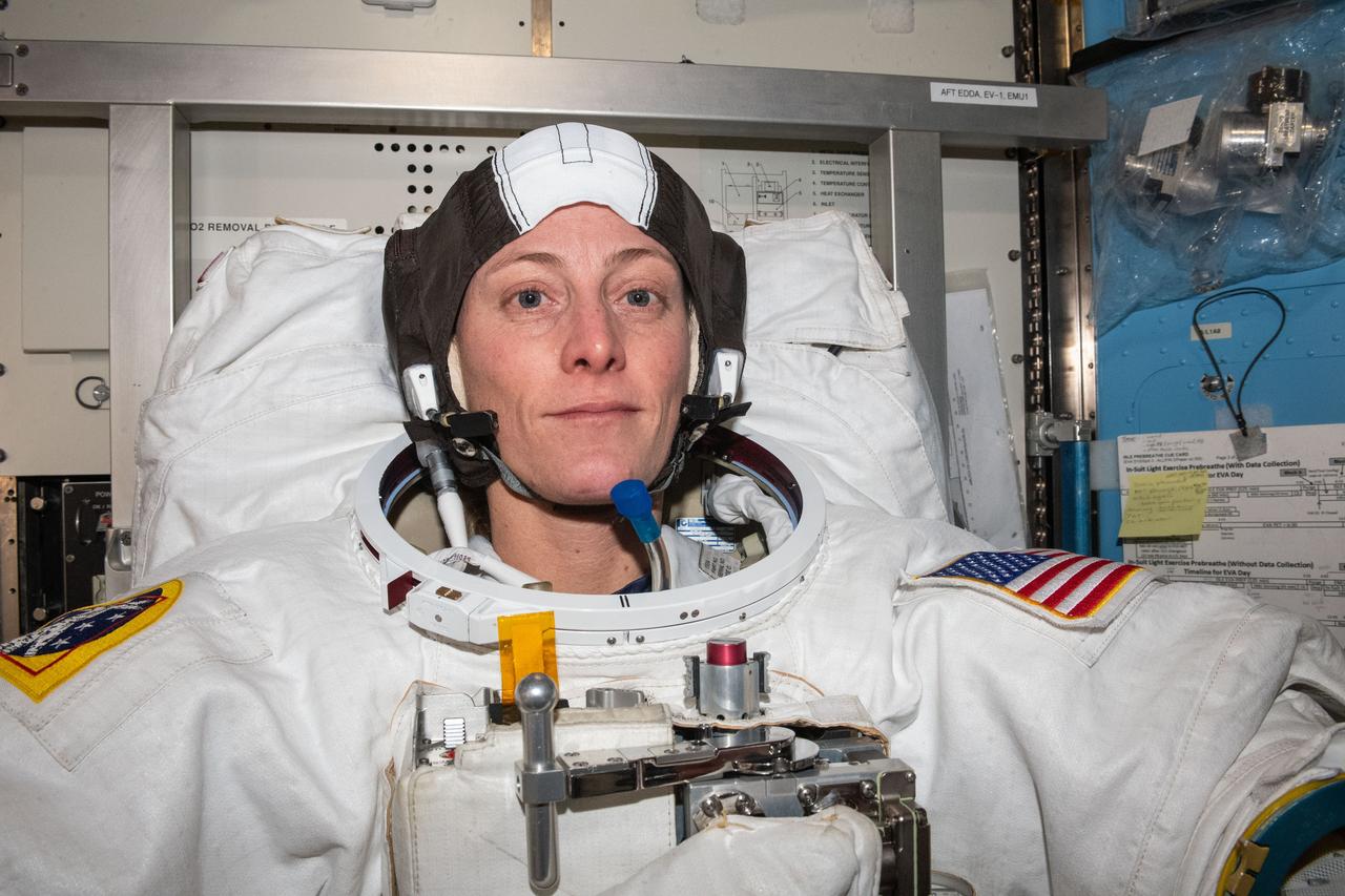 iss070e002029 (Oct. 4, 2023) --- NASA astronaut and Expedition 70 Flight Engineer Loral O'Hara is pictured trying on her spacesuit and testing its components aboard the International Space Station's Quest airlock in preparation for an upcoming spacewalk.