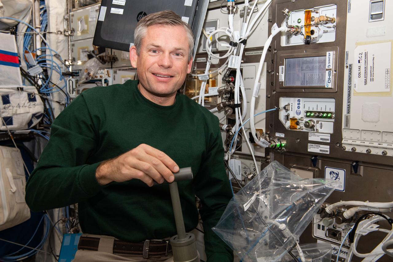 iss070e003140 (10/12/2023) ---  European Space Agency (ESA) astronaut Andreas Mogensen is seen filling an ANITA-2 sampling bag a measurement demonstration. The ANITA-2 is a compact gas analyzer which can analyze and quantify 33 trace contaminants in the atmosphere aboard the ISS automatically.
