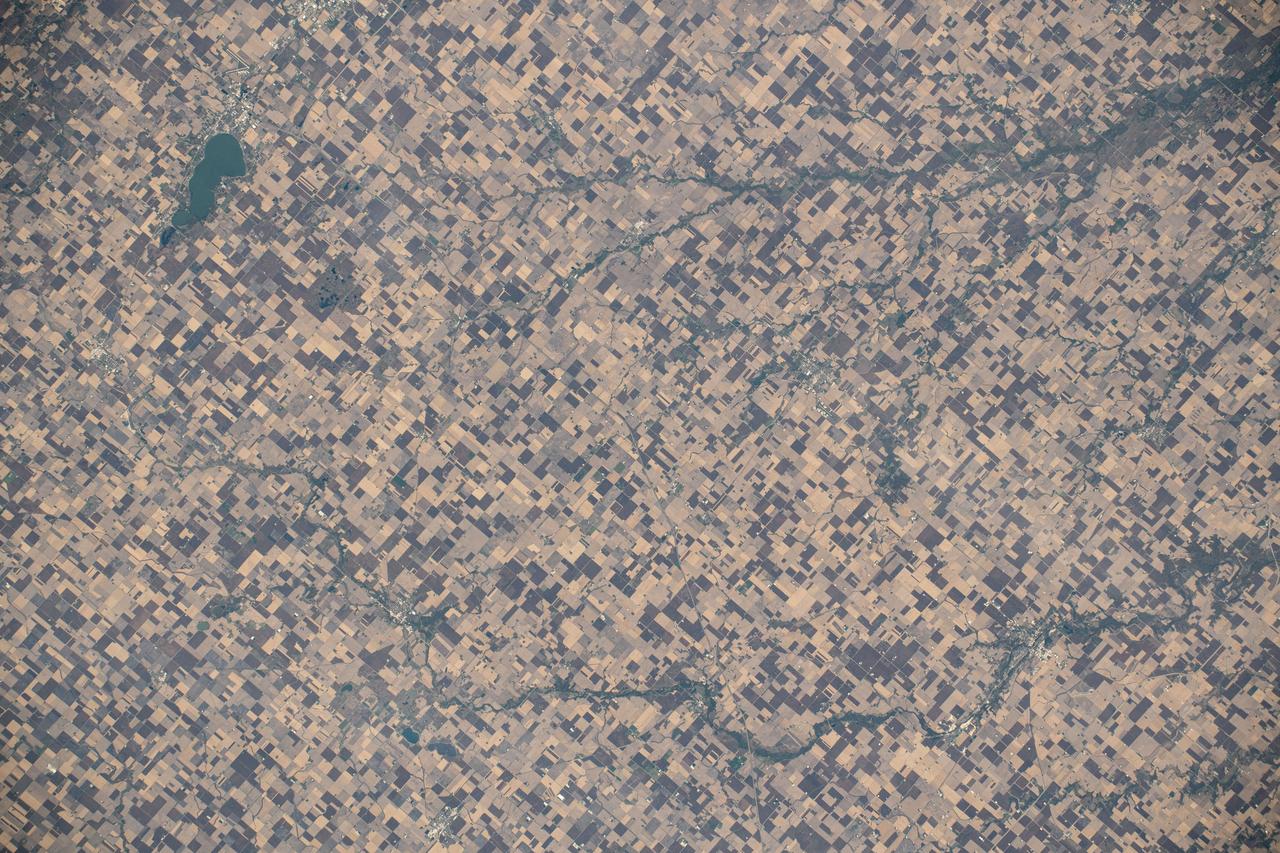 iss070e005396 (Oct. 17, 2023) --- Clear Lake, Iowa, and its namesake lake (upper left) are surrounded by farmland in this photograph from the International Space Station as it orbited 259 miles above the Hawkeye State.