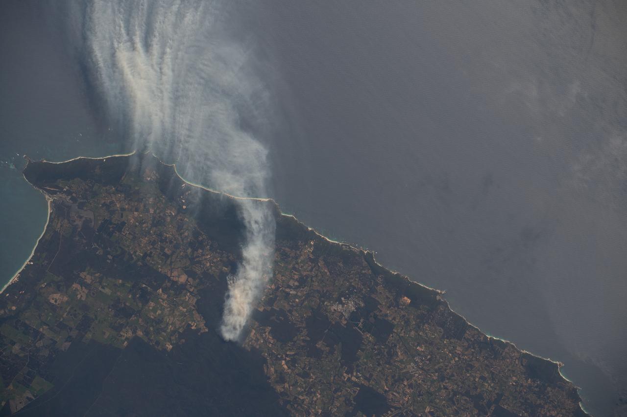 iss070e008930 (Oct. 24, 2023) --- A wildfire in Western Australia's Forest Grove National Park, with smoke billowing out into the Indian Ocean, is pictured from the International Space Station as it orbited 266 miles above.