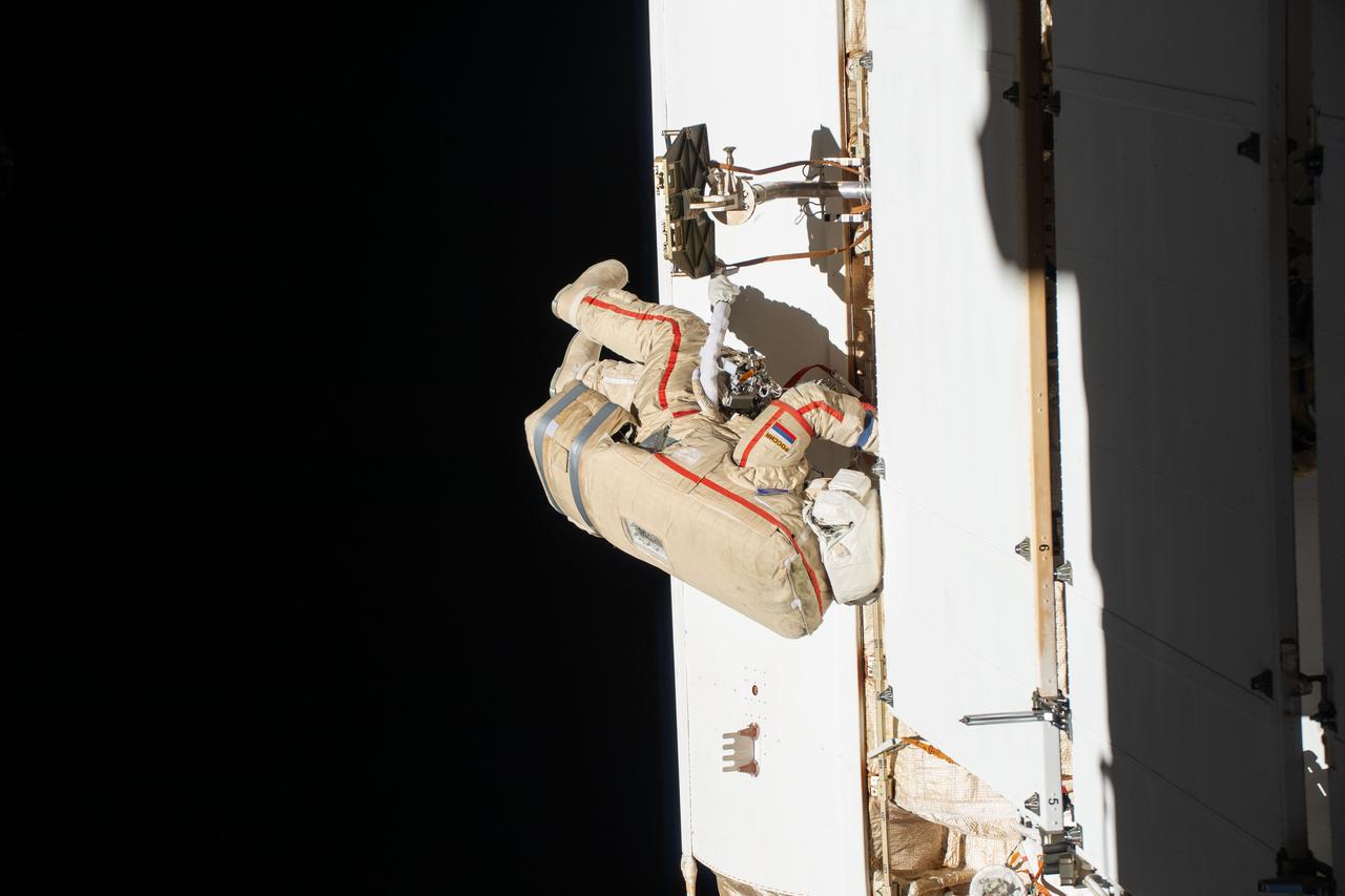 iss070e009090 (Oct. 25, 2023) --- Expedition 70 Flight Engineer Oleg Kononenko from Roscosmos is pictured during a spacewalk to inspect a backup radiator, deploy a nanosatellite, and install communications hardware on the International Space Station's Nauka science module.