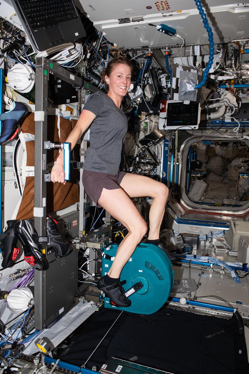 iss070e009186 (Oct. 25, 2023) --- NASA astronaut and Expedition 70 Flight Engineer Loral O'Hara pedals on an exercise cycle, also known as CEVIS, or Cycle Ergometer Vibration Isolation System, inside the International Space Station's Destiny laboratory module. The CEVIS provides aerobic and cardiovascular conditioning and supports science activities, pre-breathe spacewalk activities, periodic fitness evaluations, and pre-landing fitness evaluations.