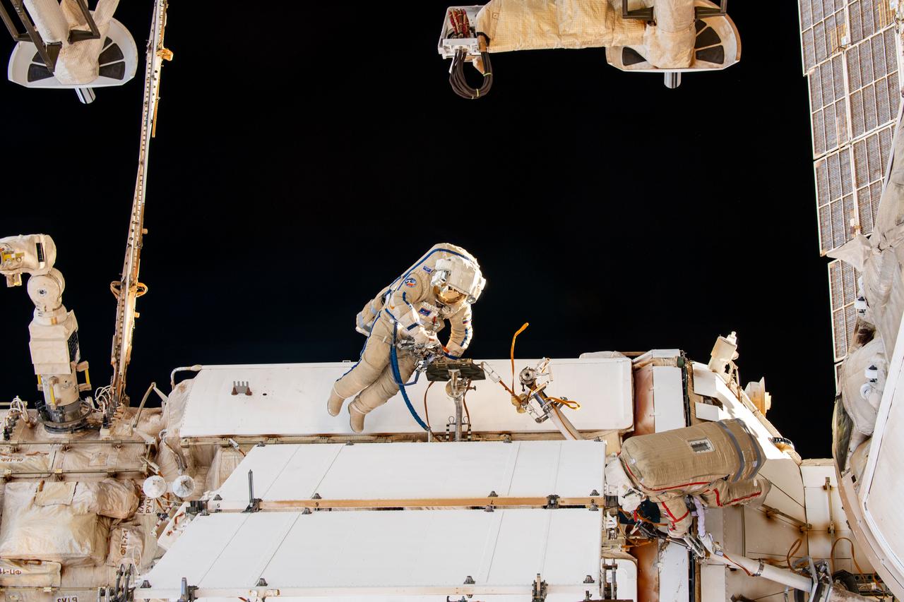 iss070e014051 (Oct. 25, 2023) --- Expedition 70 Flight Engineer Nikolai Chub from Roscosmos is pictured during a spacewalk to inspect a backup radiator, deploy a nanosatellite, and install communications hardware on the International Space Station's Nauka science module.
