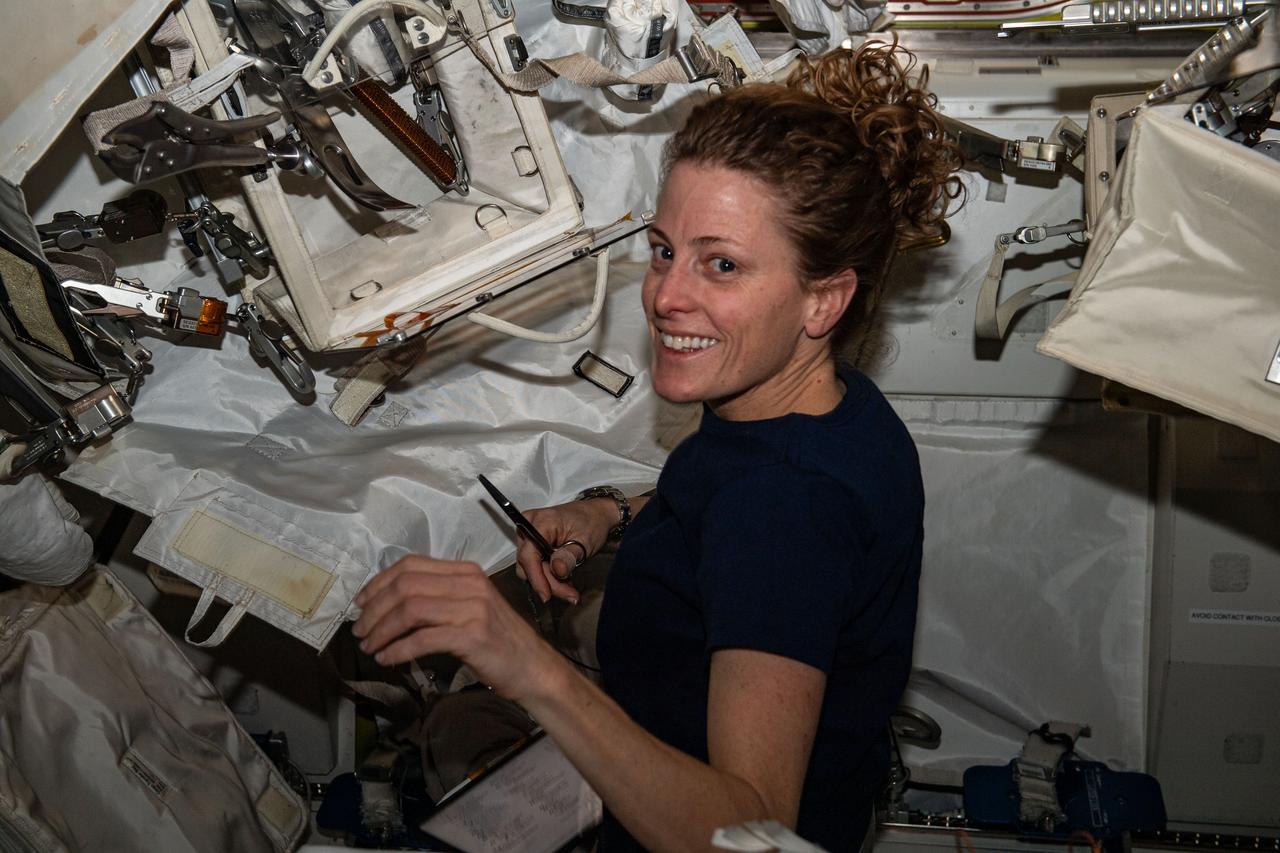 iss070e014316 (Oct. 27, 2023) --- NASA astronaut and Expedition 70 Flight Engineer Loral O'Hara configures spacewalking tools inside the International Space Station's Quest airlock.