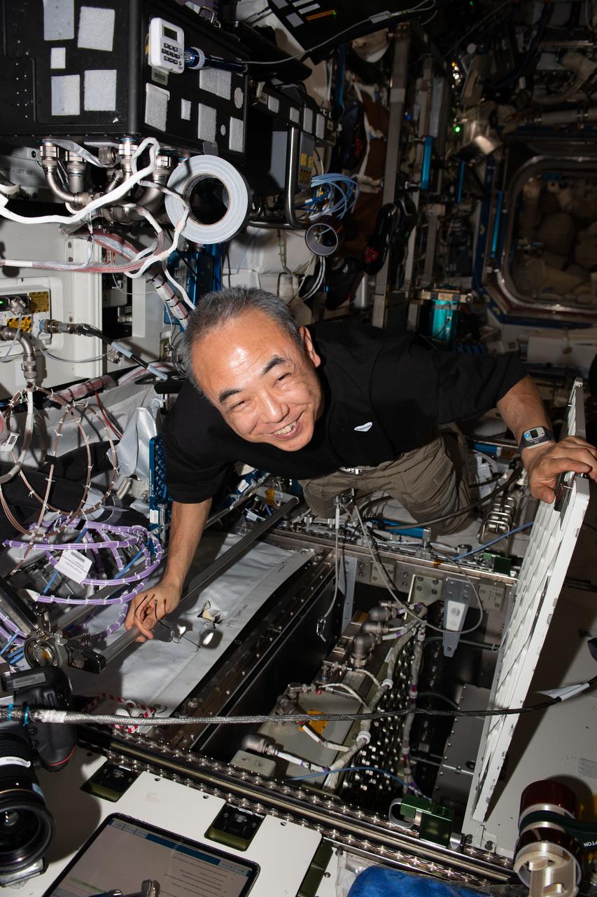 iss070e014709 (Oct. 27, 2023) --- JAXA (Japan Aerospace Exploration Agency) astronaut and Expedition 70 Flight Engineer Satoshi Furukawa replaces hardware inside an avionics rack located aboard the International Space Station's Destiny laboratory module.