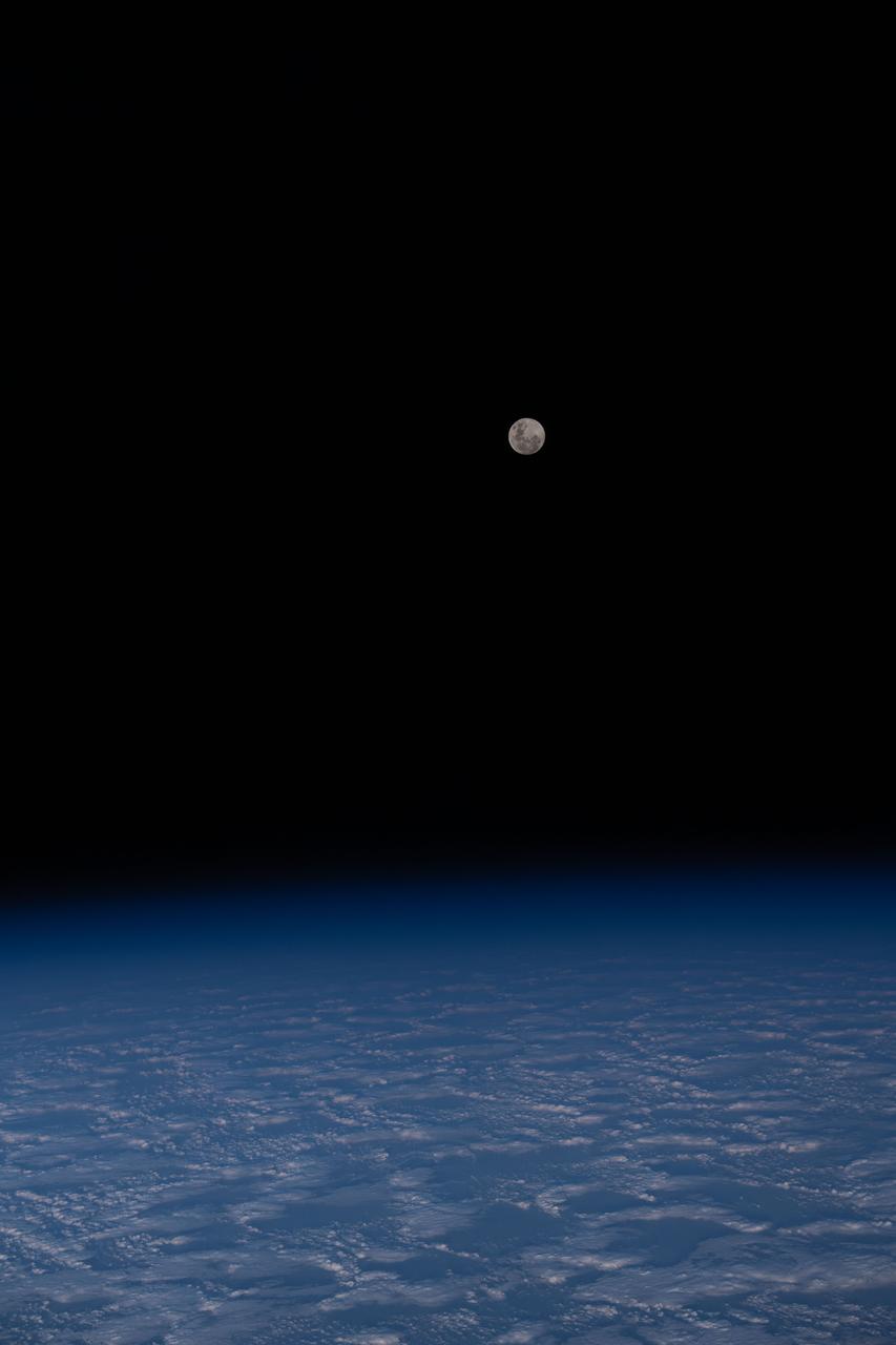 iss070e014820 (Oct. 28, 2023) --- The Full Moon is pictured from the International Space Station as it orbited 271 miles above a cloudy south Indian Ocean half-way between Australia and Antarctica.