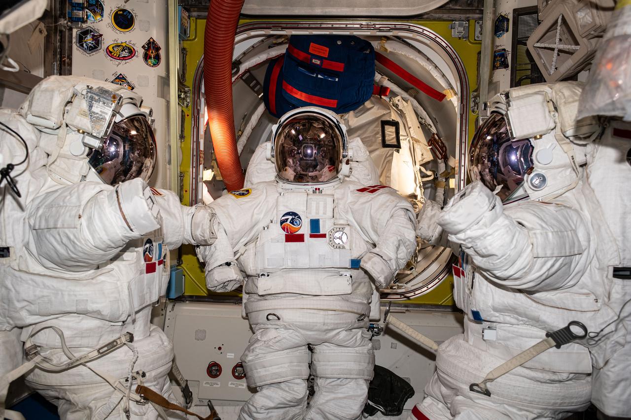 iss070e021451 (Nov. 7, 2023) --- Three near-assembled spacesuits, with their gloves unattached, are pictured inside the International Space Station's Quest airlock ahead of an upcoming spacewalk.