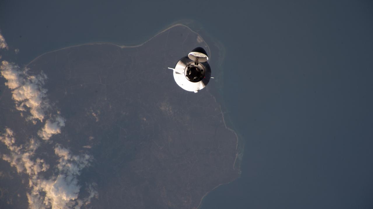 iss070e022097 (Nov. 11, 2023) --- The SpaceX Dragon cargo craft, on the company's 29th commercial resupply mission for NASA, approaches the International Space Station while orbiting 261 miles above the Lesser Sunda Islands.