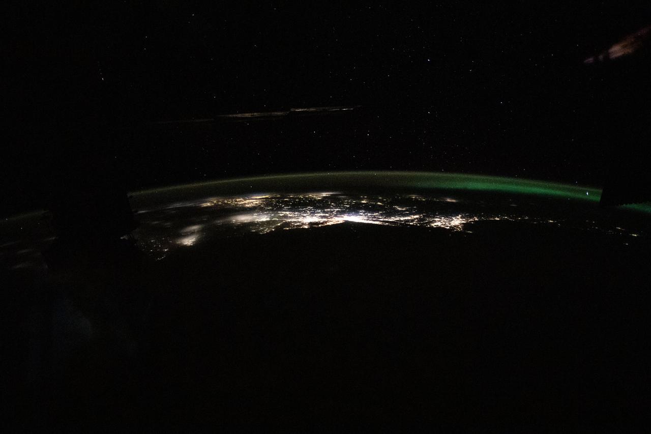 iss070e025086 (Nov. 15, 2023) --- The photograph from the International Space Station looks back toward the northeast Atlantic coast of the United States revealing the city lights (from left) of Norfolk, Virginia, to Boston, Massachusetts. At far right, an aurora in northern Canada crowns the Earth's horizon.