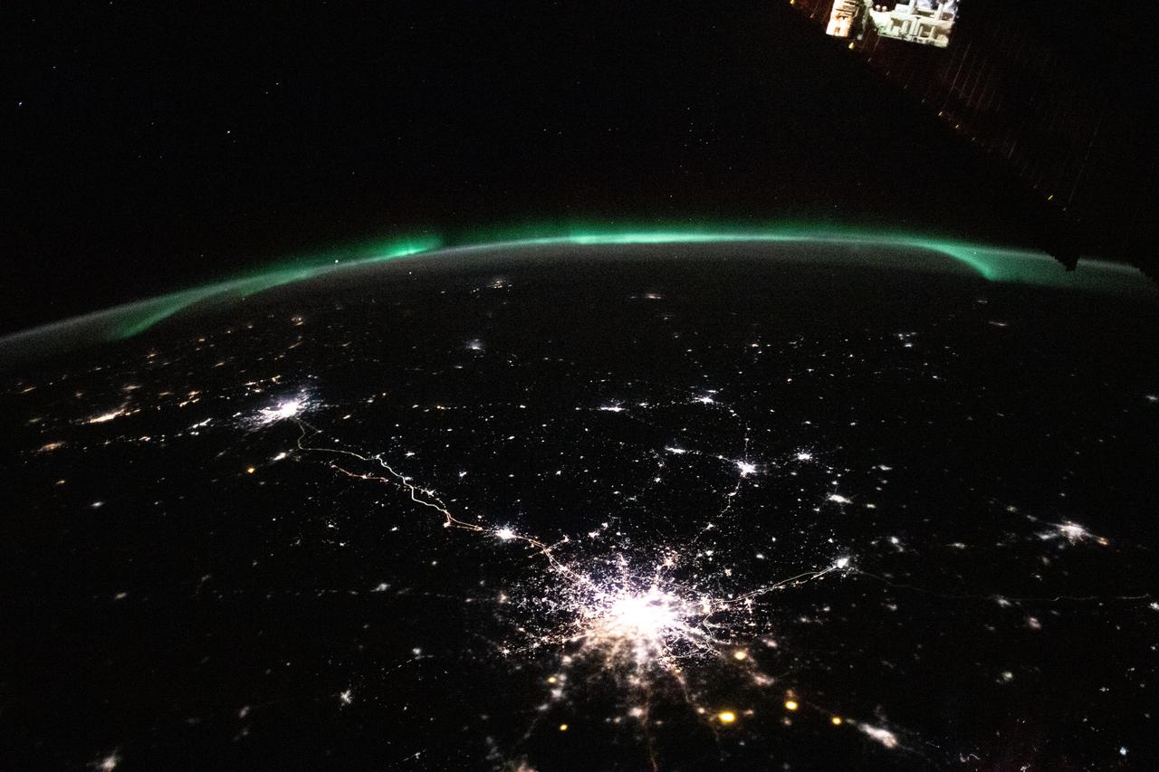 iss070e026402 (Nov. 17, 2023) --- The city lights (bottom center to far left) of Moscow and Saint Petersburg in Russia, to Helsinki, Finland, are framed by an aurora in this photograph from the International Space Station as it orbited 264 miles above.