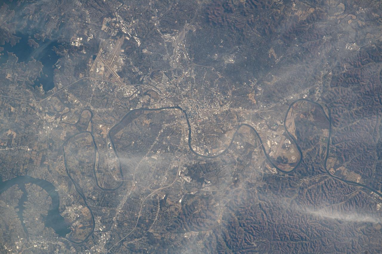 iss070e031247 (Nov. 25, 2023) --- Nashville, Tennessee, split by the Cumberland River, is pictured from the International Space Station as it orbited 261 miles above the Volunteer State. At top left, is the Nashville International Airport near the Percy Priest Lake.