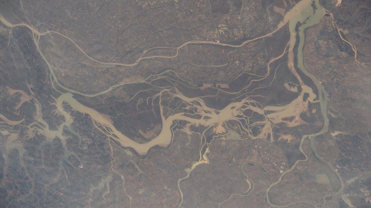 iss070e031373 (Nov. 28, 2023) --- Rivers and lakes are surrounded by villages in the south-central portion of China in this photograph from the International Space Station as it orbited 260 miles above the Asian nation