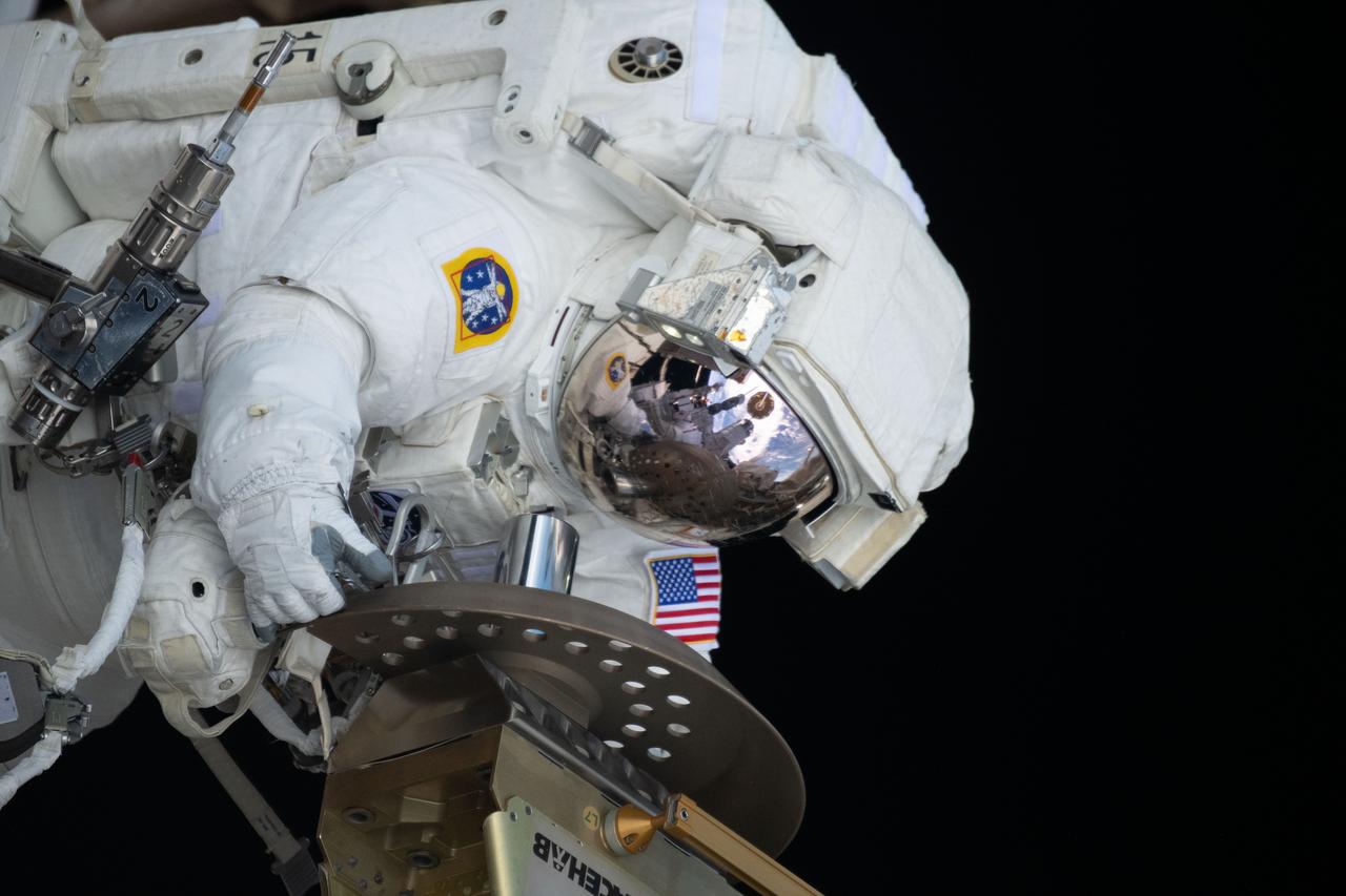 iss070e37241 (Nov. 1, 2023) --- Expedition 70 Flight Engineer and NASA astronaut Loral O'Hara is pictured during a spacewalk for maintenance on the International Space Station's port solar alpha rotary joint, which allows the solar arrays to track the Sun and generate electricity to power the orbital outpost.