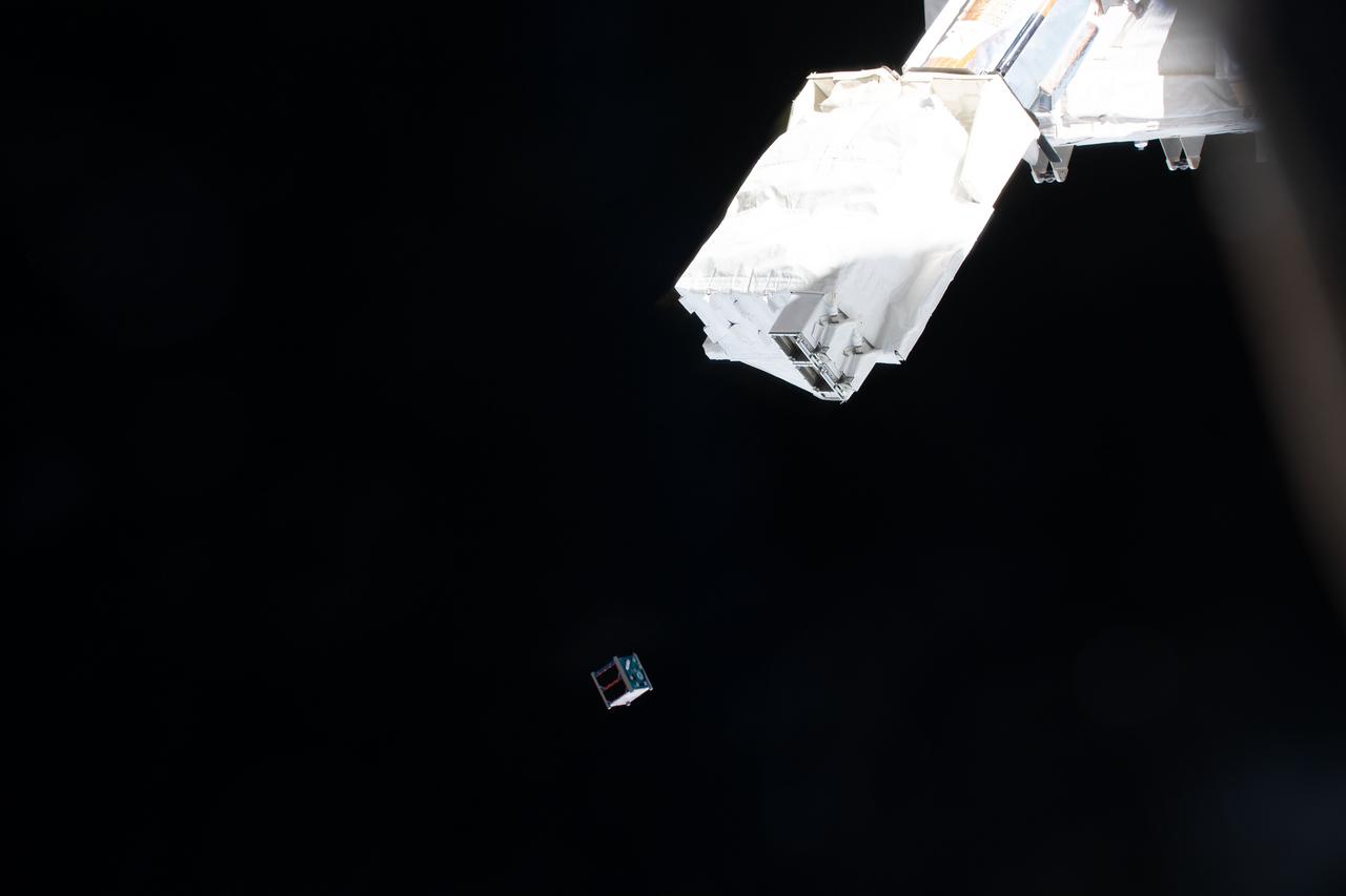 iss070e041245 (Dec. 18, 2023) --- The Clark sat-1 CubeSat is deployed from a small satellie deployer in the grips of the Japanese robotic arm attached to the Kibo laboratory module. Clark sat-1, launched to the Interational Space Station aboard the SpaceX Dragon cargo spacecraft, was developed by students at Clark Next High School in Tokyo, Japan, and its primary mission is to transmit voice and imagery data to ground control stations on Earth.
