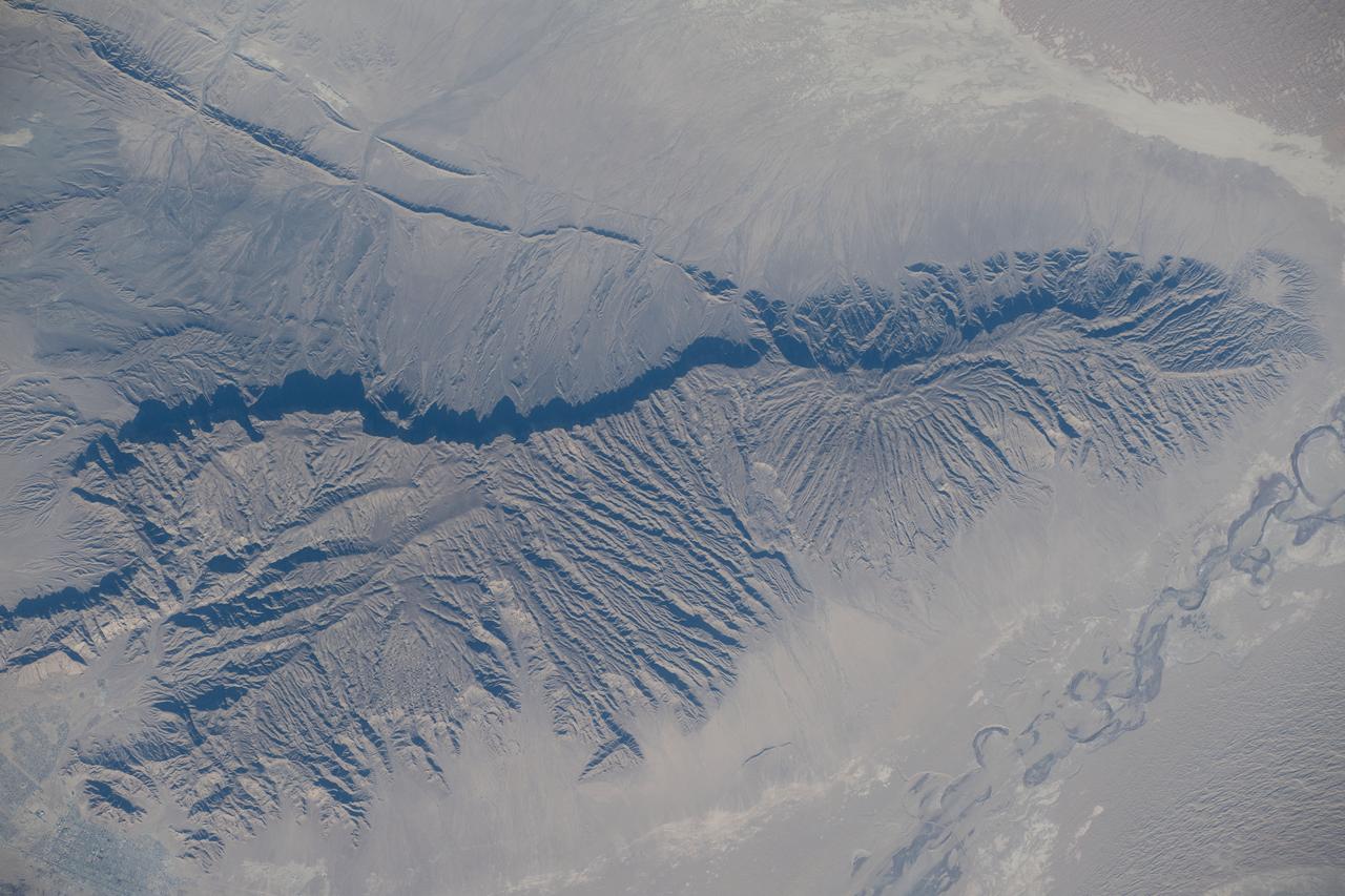 iss070e042553 (Dec. 17, 2023) --- The Uly Balkan mountian range in Turkmenistan near the coast of the Caspian Sea is pictured from the International Space Station as it orbited 260 miles above the central Asia nation.