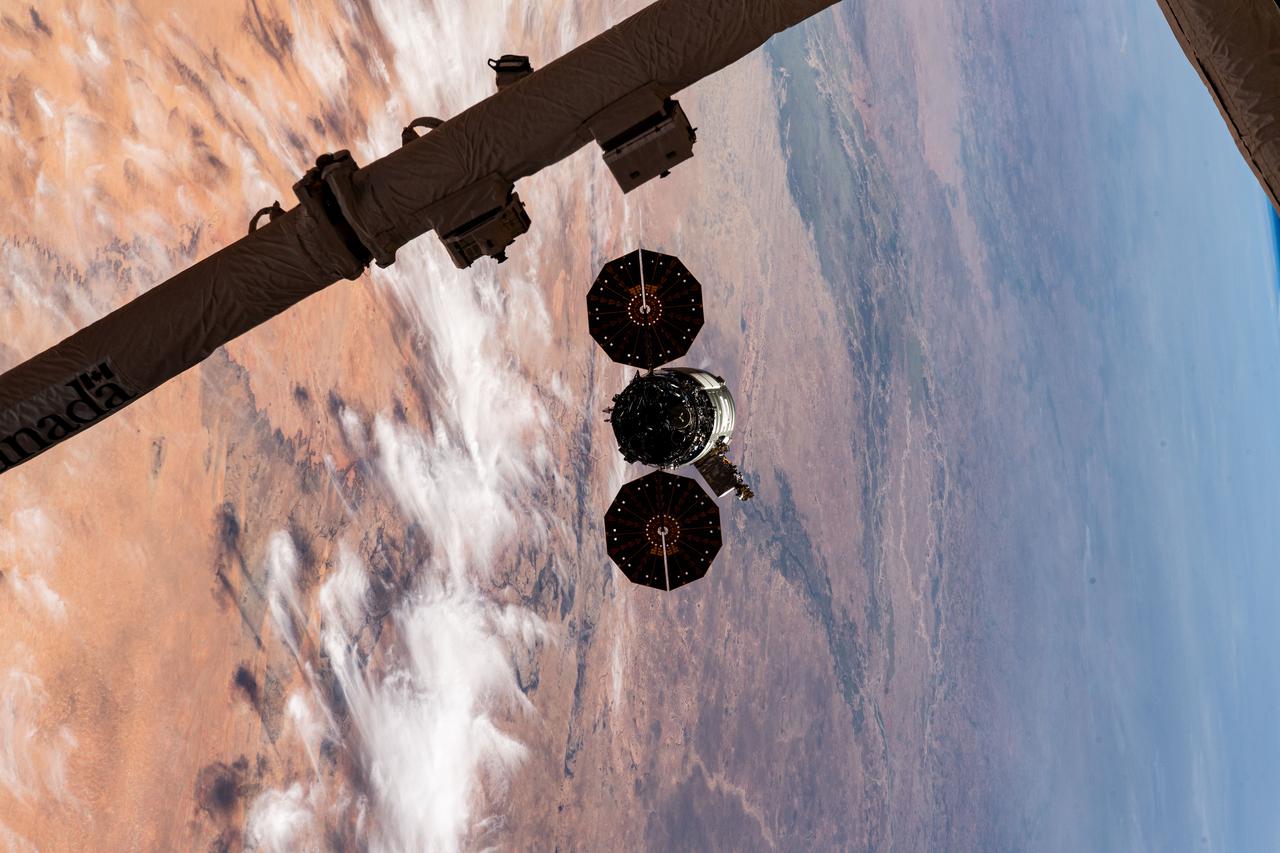 iss070e044312 (Dec. 22, 2023) --- Northrop Grumman's Cygnus space freighter is pictured departing the International Space Station after it was released from the grip of the Canadarm2 robotic arm. The orbital complex was soaring 258 miles above the African nation of Mauritania at the time of this photograph.