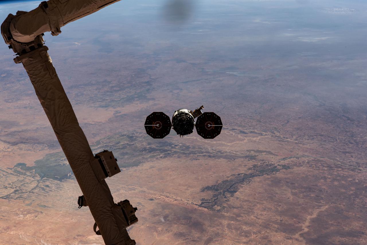 iss070e044314 (Dec. 22, 2023) --- Northrop Grumman's Cygnus space freighter is pictured departing the International Space Station after it was released from the grip of the Canadarm2 robotic arm. The orbital complex was soaring 258 miles above the African nation of Mauritania at the time of this photograph. The major land feature toward the center left, is the Inner Niger Delta, an inland delta created by the Niger River in the central portion of Mali.