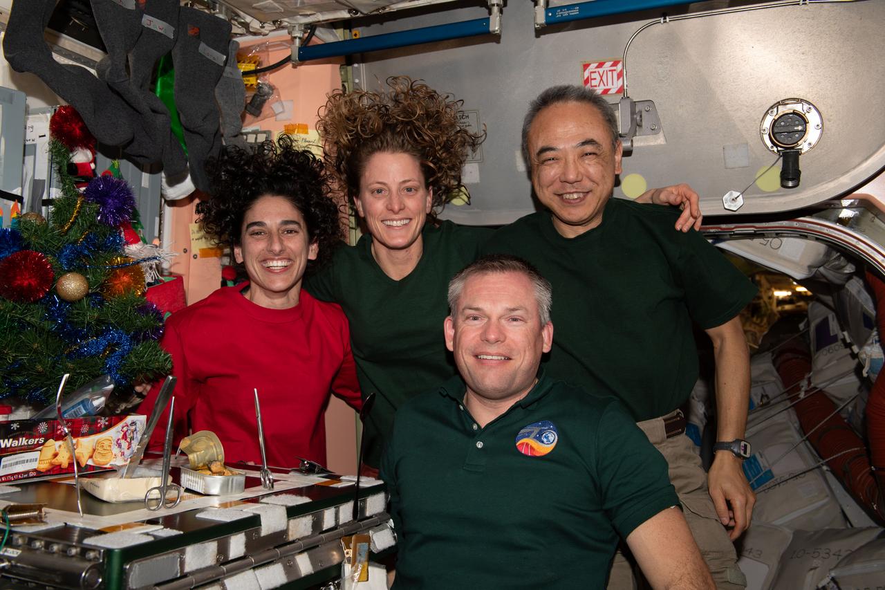 iss070e045409 (Dec. 24, 2023) --- Four Expedition 70 crewmates join each other inside the International Space Station's Unity module for a Christmas Eve portrait. Clockwise from left are, NASA Flight Engineers Jasmin Moghbeli and Loral O'Hara; Flight Engineer Koichi Wakata from JAXA (Japan Aerospace Exploration Agency); and Commander Andreas Mogensen from ESA (European Space Agency).