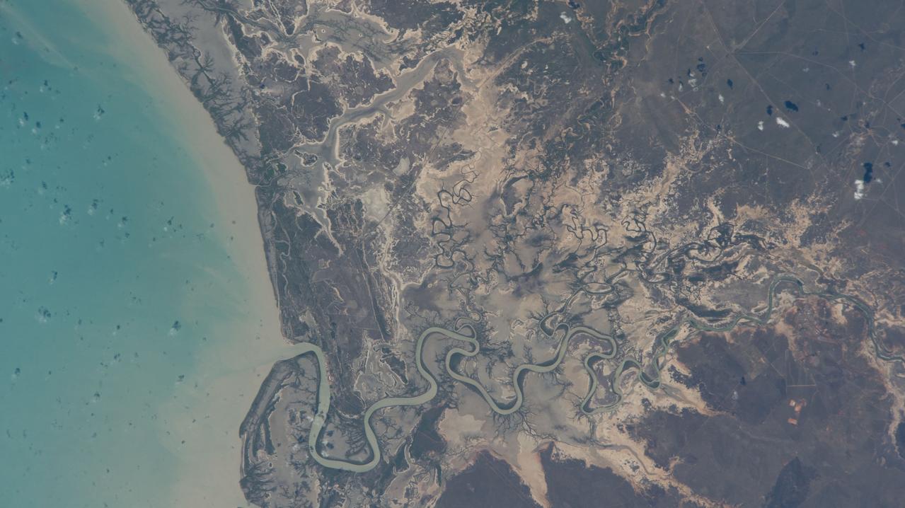 iss070e047310 (Dec. 23, 2023) --- Australia's Norman River leads into the Gulf of Carpentaria in this photograph from the International Space Station as it orbited 262 miles above the province of Queensland.