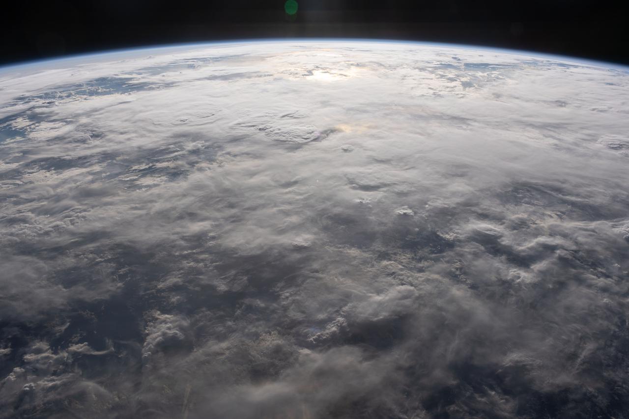 iss070e062791 (Jan. 8, 2024) --- A cloud-covered Indian Ocean, illuminated about an hour before sunset, is pictured from the International Space Station as it orbited 260 miles above just off the northeast coast of the island nation of Madagascar.