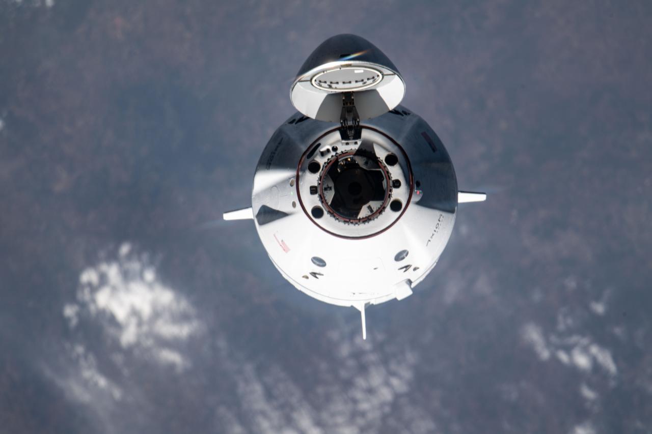 iss070e075419 (Jan. 20, 2024) --- The SpaceX Dragon Freedom spacecraft carrying the four-member Axiom Mission 3 (Ax-3) crew is pictured approaching the International Space Station 260 miles above southern India.