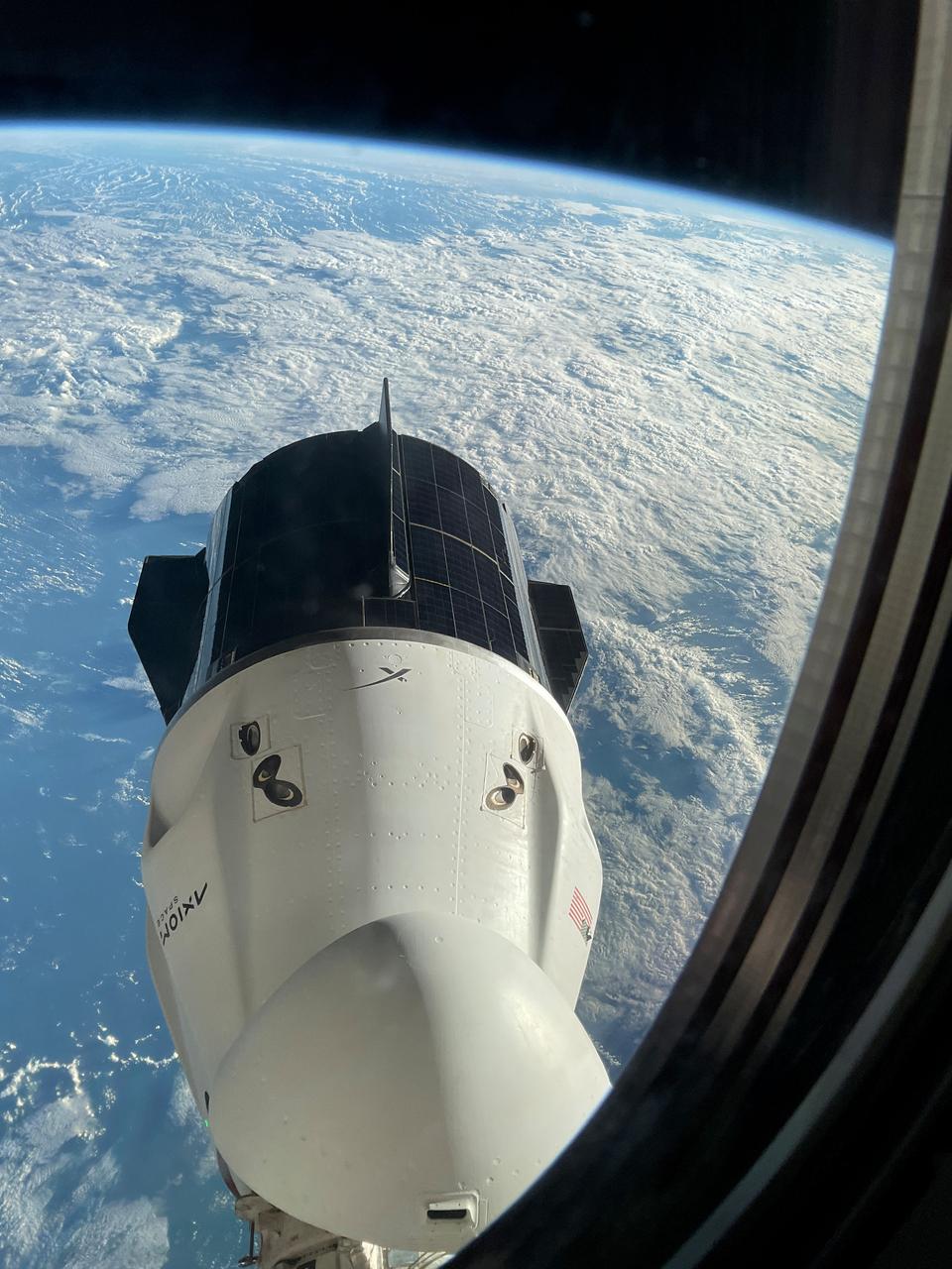 iss070e087501 (Feb. 7, 2024) --- The SpaceX Dragon Freedom spacecraft is pictured from a window aboard the SpaceX Dragon Endurance spacecraft. Both spacecraft are docked to ports on the International Space Station's Harmony module. Freedom is seen moments before undocking from Harmony's forward port with the Axiom Mission 3 crew aboard.