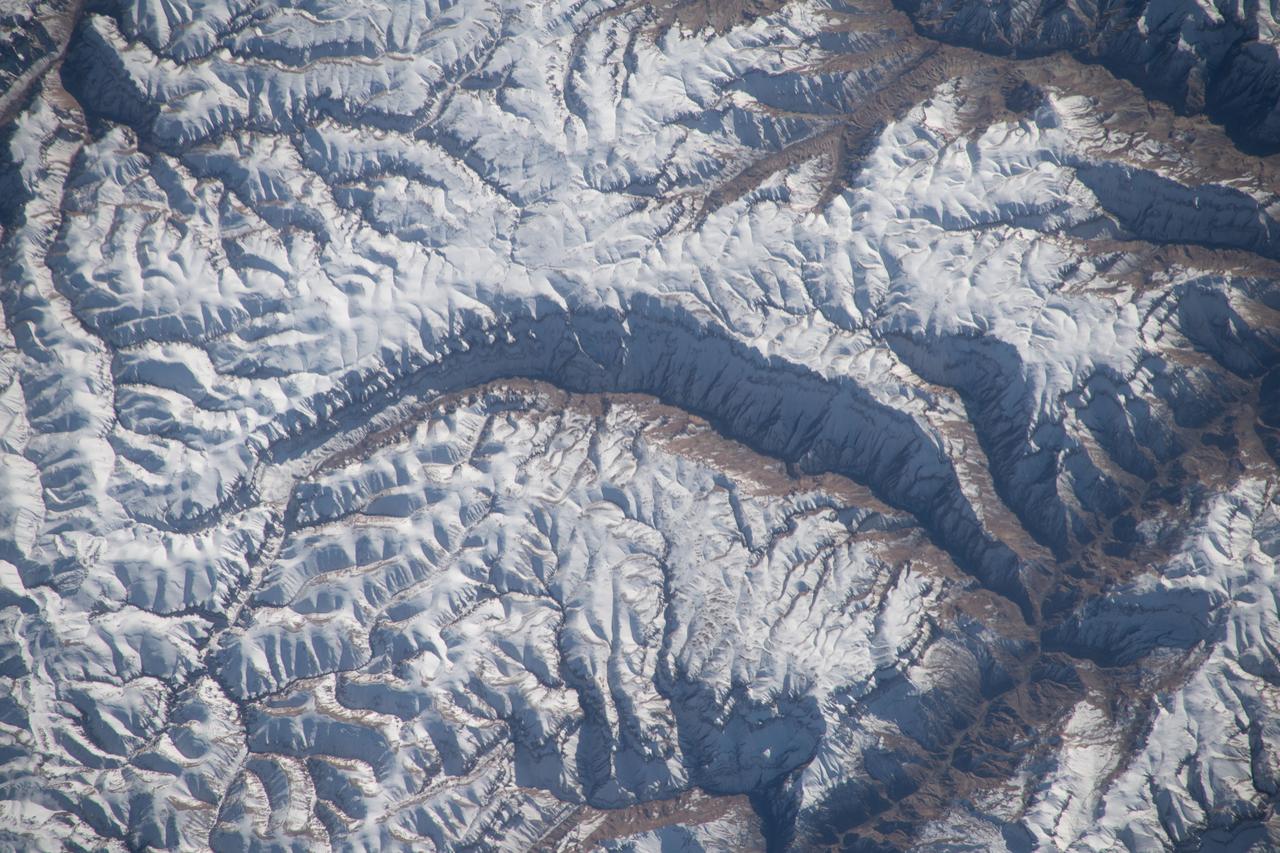 iss070e091704 (Feb. 10, 2024) --- A portion of the Pamir Mountains, a mountain range at the northwest junction of the Himalayas and crossing several Central Asia countries, is pictured from the Interntional Space Station as it orbited 261 miles above Uzbekistan.