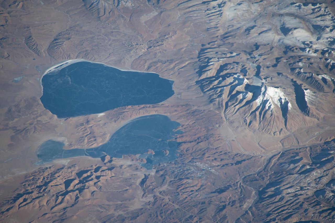 iss070e091722 (Feb. 10, 2024) --- Lakes Mansarovar (top) and Rakshastal, on the Chinese side of the Himalayan border with India, are pictured from the International Space Station as it orbited 260 miles above the Indian subcontinent.