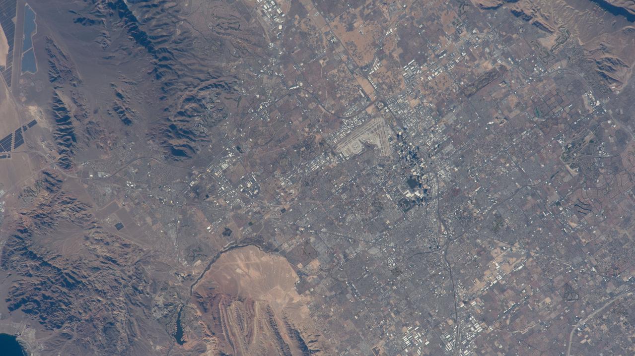 iss070e091729 (Feb. 11, 2024) --- The International Space Station was soaring 261 miles above Las Vegas at the time of this photograph minutes before kickoff at Super Bowl LVIII on Feb. 11, 2024. Landmarks pictured from an external station camera are, Allegiant Stadium, The Sphere (partially obscured by shadow), and Harry Reid International Airport.