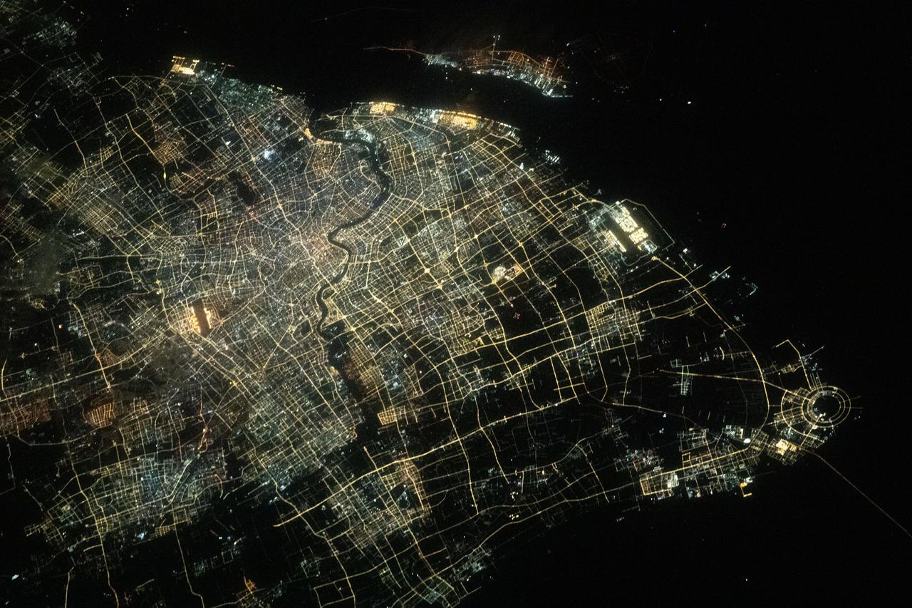 iss070e096351 (Feb. 17, 2024) --- The city lights of Shanghai, the most populous city in China with a population of about 24.9 million, and the Huangpu River flowing through downtown, are pictured from the International Space Station as it orbited 260 miles above the East China Sea.