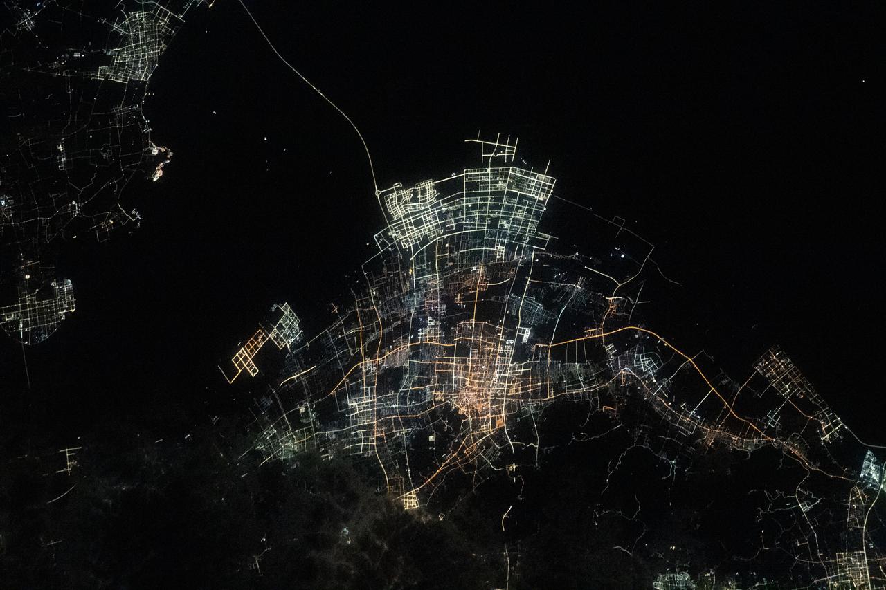 iss070e096353 (Feb. 17, 2024) --- The night lights of Chinese villlages on Hangzhou Bay are pictured from the International Space Station as it orbited 260 miles above the East China Sea.