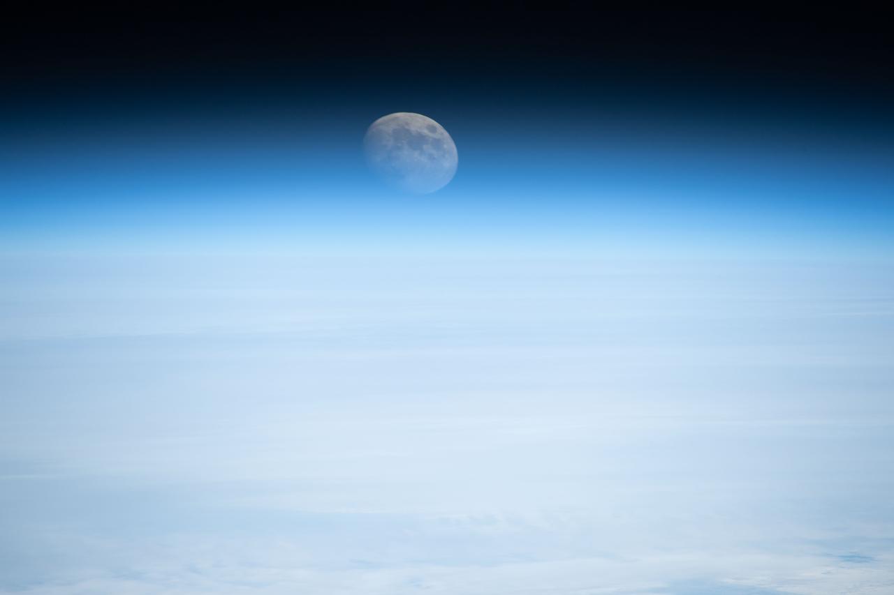 iss070e096713 (Feb. 20, 2024) --- Earth's atmosphere refracts the light of the waxing gibbous Moon in this photograph from the International Space Station as it orbited 261 miles above the Atlantic Ocean off the coast of the northeastern United States.