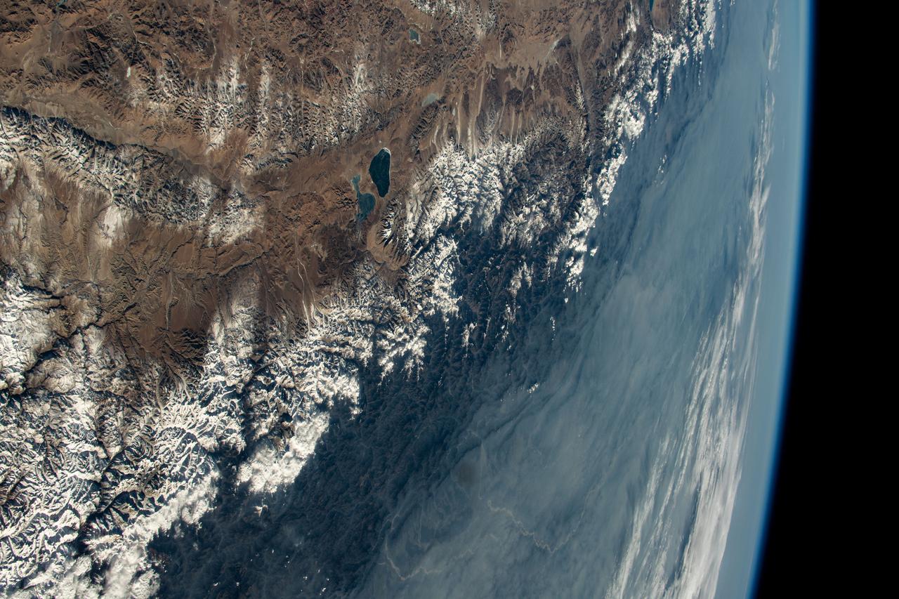 iss070e097638 (Feb. 11, 2024) --- The Himalayas, separating the Indian subcontinent from China, home to the South Asian nations of Nepal and Bhutan, and with Lakes Mansarovar and Rakshastal on the Chinese side, are pictured from the International Space Station as it orbited 261 miles above.