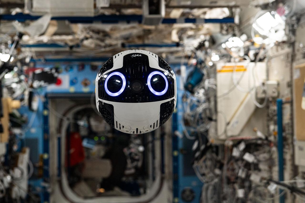 iss070e102490 (Feb. 27, 2024) --- JAXA's (Japan Aerospace Exploration Agency) free-flying robotic camera, also known as the JEM (Japanese Experiment Module) Internal Ball Camera 2, is pictured during a technology demonstration inside the Kibo laboratory module. The Internal Ball Camera 2 is being tested for its ability to autonomously maneuver and navigate aboard the International Space Station while photographing and videotaping crew activities.