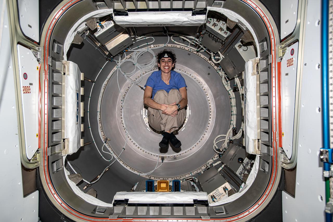 iss070e102740 (Feb. 26, 2024) --- Expedition 70 Flight Engineer and NASA astronaut Jasmin Moghbeli is photographed inside the NanoRacks Bishop airlock. Bishop can be uninstalled from its home on the Tranquility module for portable operations. It can also be used to stow cargo and extract or install payloads.
