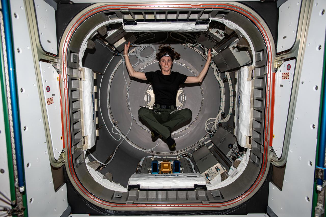 iss070e102747 (Feb. 26, 2024) --- Expedition 70 Flight Engineer and NASA astronaut Loral O'Hara is photographed inside the NanoRacks Bishop airlock. Bishop can be uninstalled from its home on the Tranquility module for portable operations. It can also be used to stow cargo and extract or install payloads.