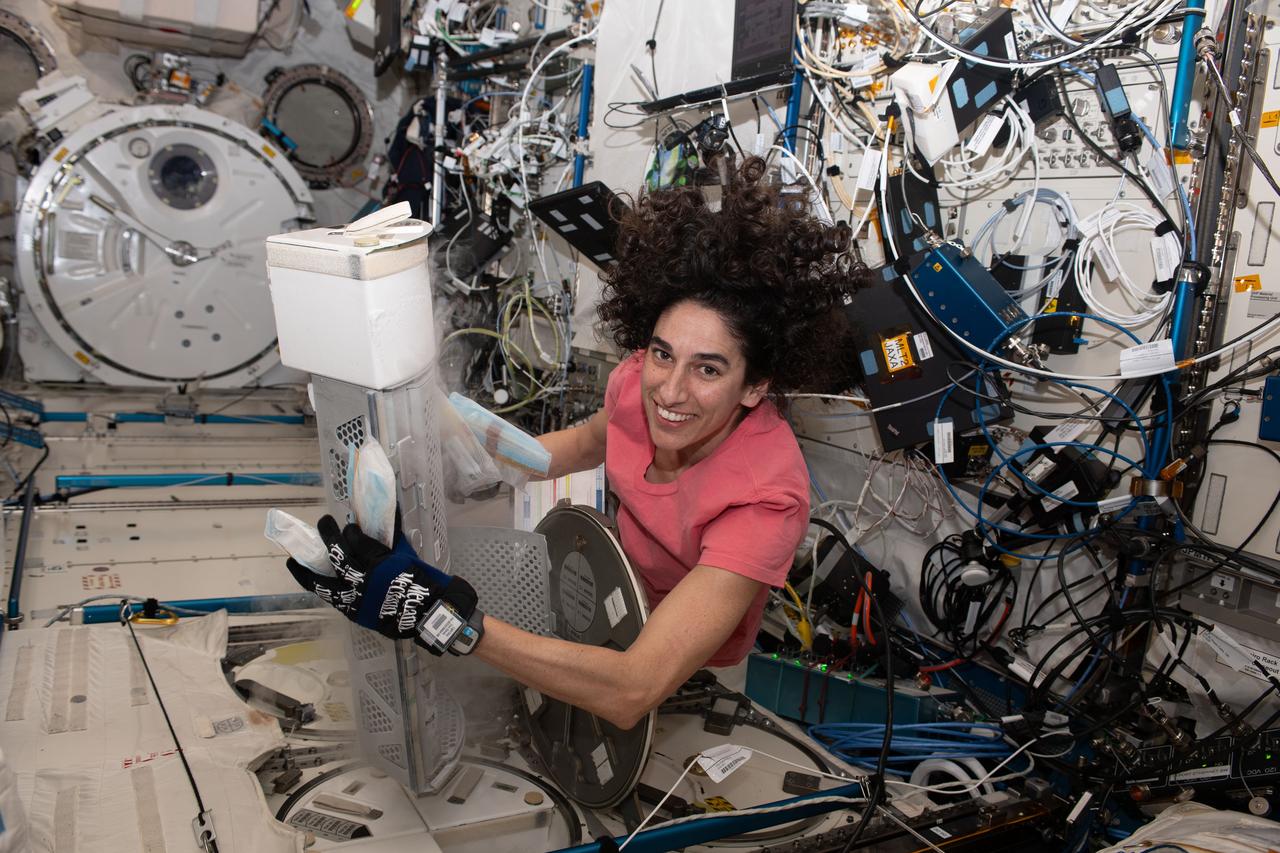 iss070e108265 (3/6/2024) --- Flight Engineer Jasmin Moghbeli works to retrieve Media Bags for the SS: Engineering Stem Cell-Derived Cardiac Microtissues with Metabolic Regulators in Space to Promote Cardiomyocyte Maturation (Project EAGLE) investigation from Minus Eighty Degree Laboratory Freezer for ISS-1 (MELFI-1). Photo was taken in the Kibo Japanese Experiment Module (JEM).