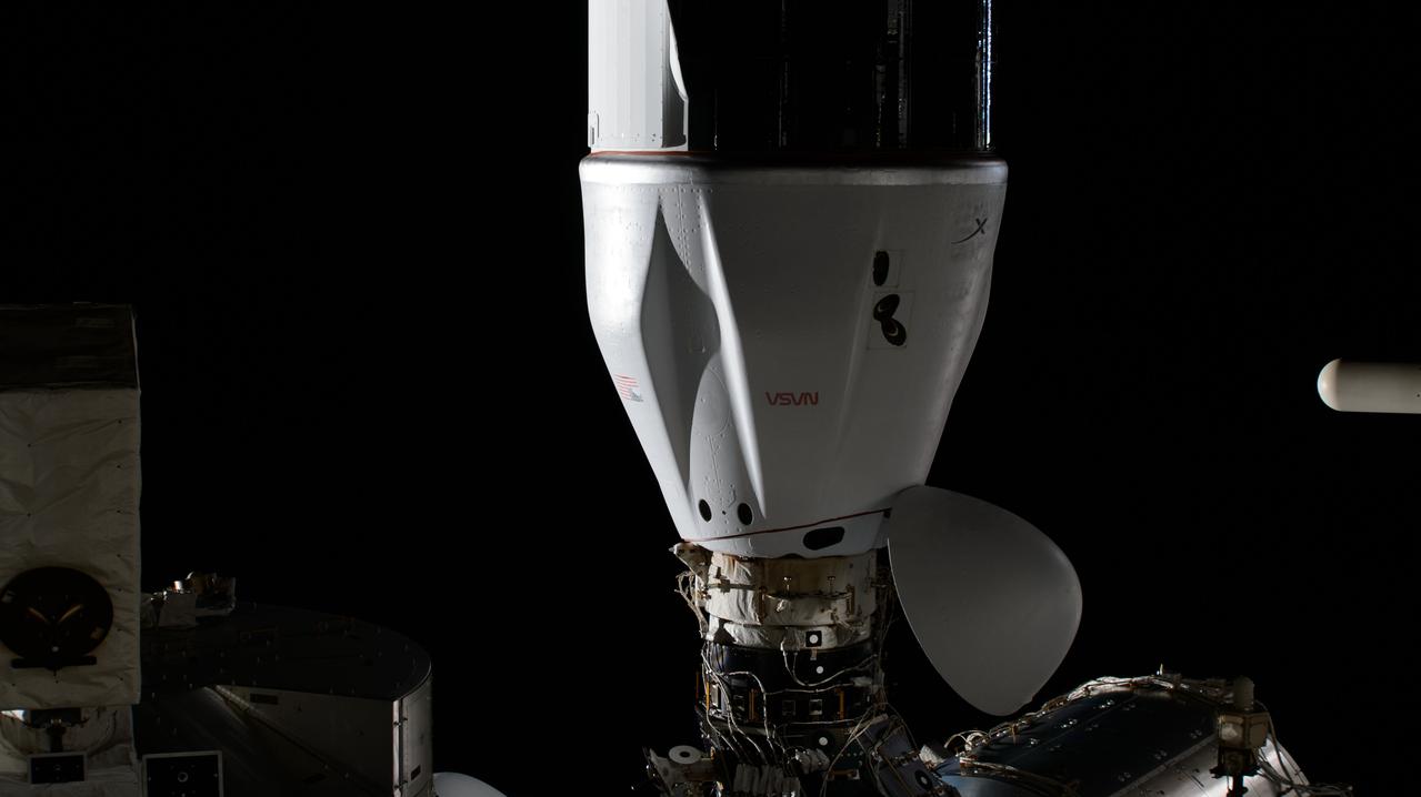 iss070e129455 (March 23, 2024) --- The SpaceX Dragon cargo spacecraft, on NASA's 30th Commercial Resupply Services (CRS-30) mission, is pictured docked to the space-facing port on the International Space Station's Harmony module.