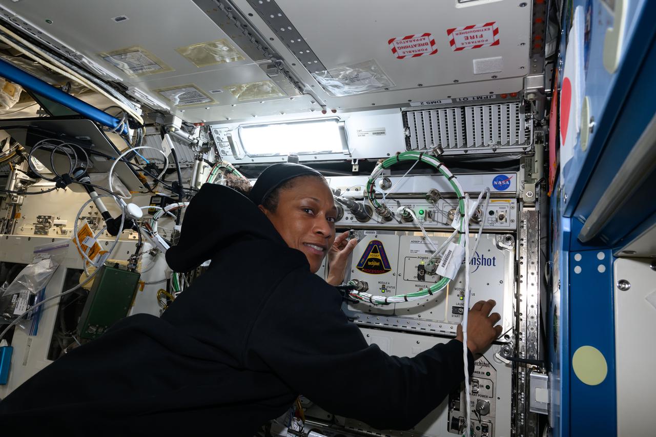 iss070e129706 (March 25, 2024) --- Expedition 70 Flight Engineer and NASA astronaut Jeanette Epps installs the Advanced Space Experiment Processor-2, or ADSEP-2. The scientific device can interface with the Dragon and Cygnus cargo craft and houses cassettes that process samples for biology and physics research including cell and tissue culturing, protein crystal growth, microorganism and bacteria studies, and materials science research.