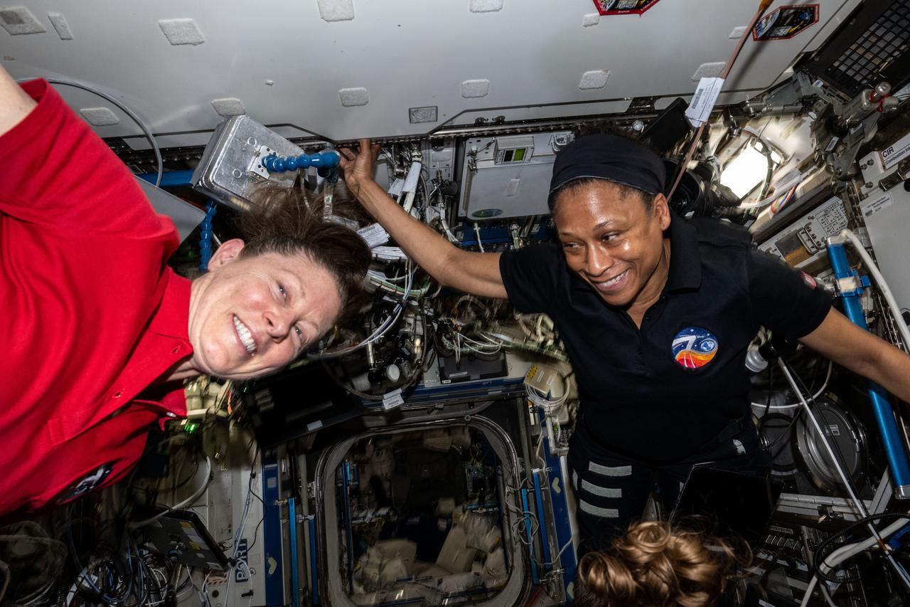 iss070e130179 (March 28, 2024) --- Expedition 70 Flight Engineers (from left) Tracy C. Dyson and Jeanette Epps, both NASA astronauts, are pictured aboard the International Space Station's Destiny laboratory module.