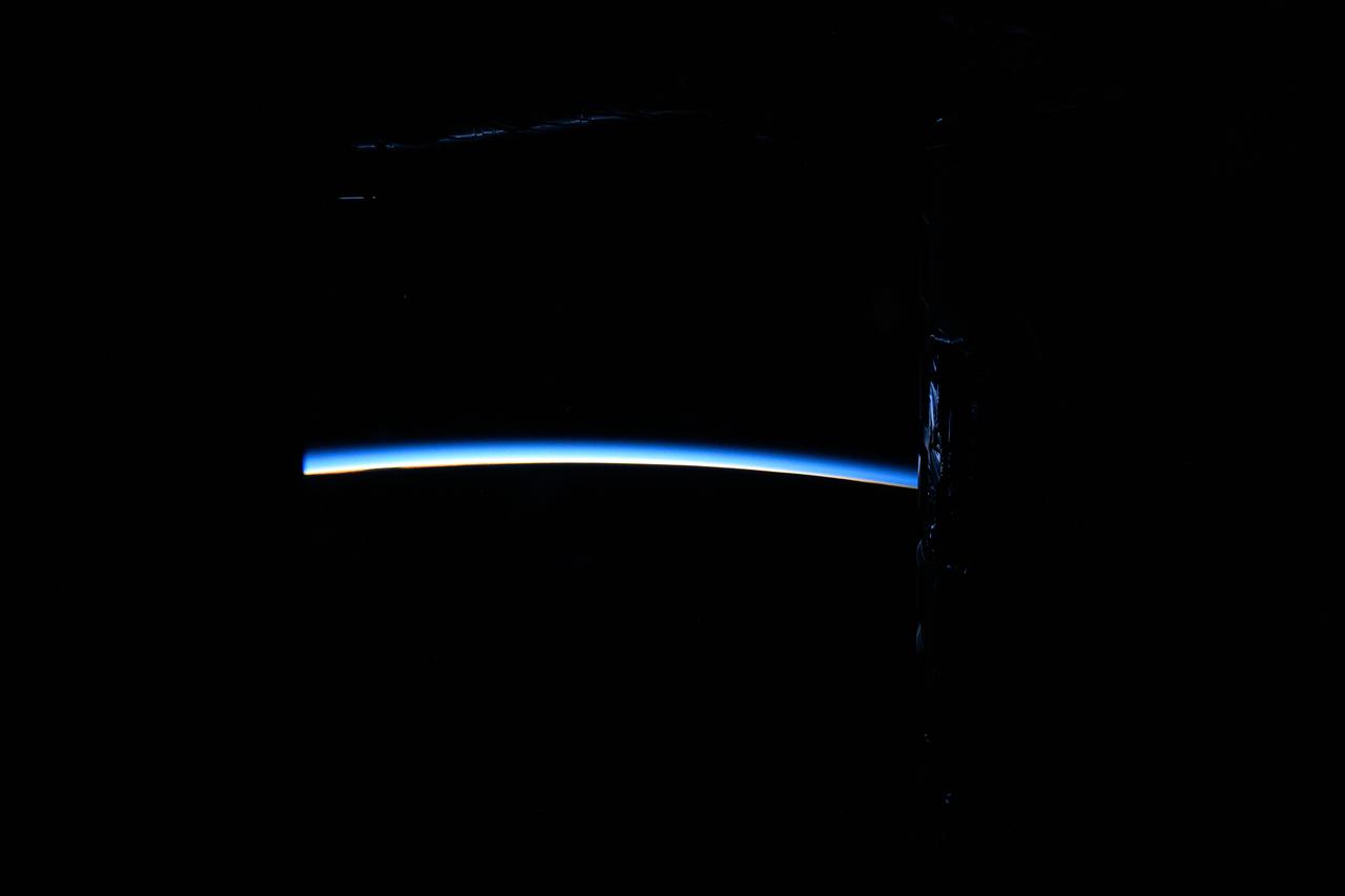 iss071e000922 (April 6, 2024) -- The first moments of an orbital sunrise crown Earth's horizon as the International Space Station soared 268 miles above the Pacific Ocean. Astronauts aboard the orbiting laboratory experience 16 sunrises and sunsets per day.