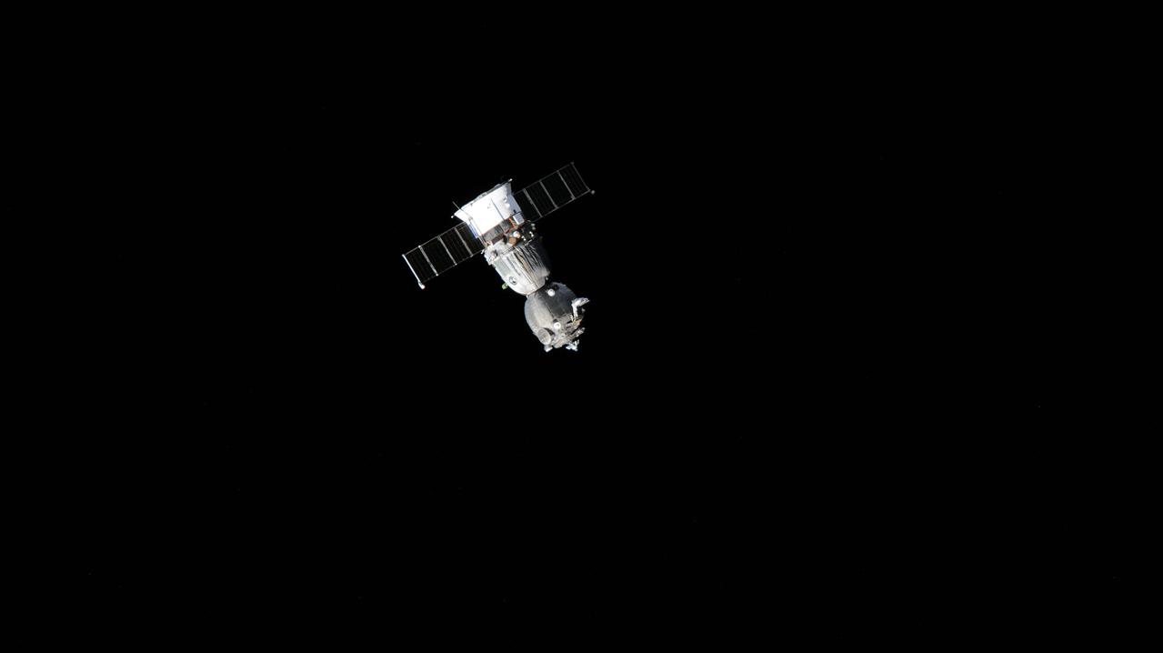 iss071e001345 (April 6, 2024) --- The Soyuz MS-24 spacecraft is pictured departing the vicinity of the International Space Station after undocking moments earlier from the Rassvet module. Aboard the Soyuz crew ship for the ride back to Earth were NASA astronaut Loral O'Hara, Roscosmos cosmonaut Oleg Novitskiy, and Belarus spaceflight participant Marina Vasilevskaya.