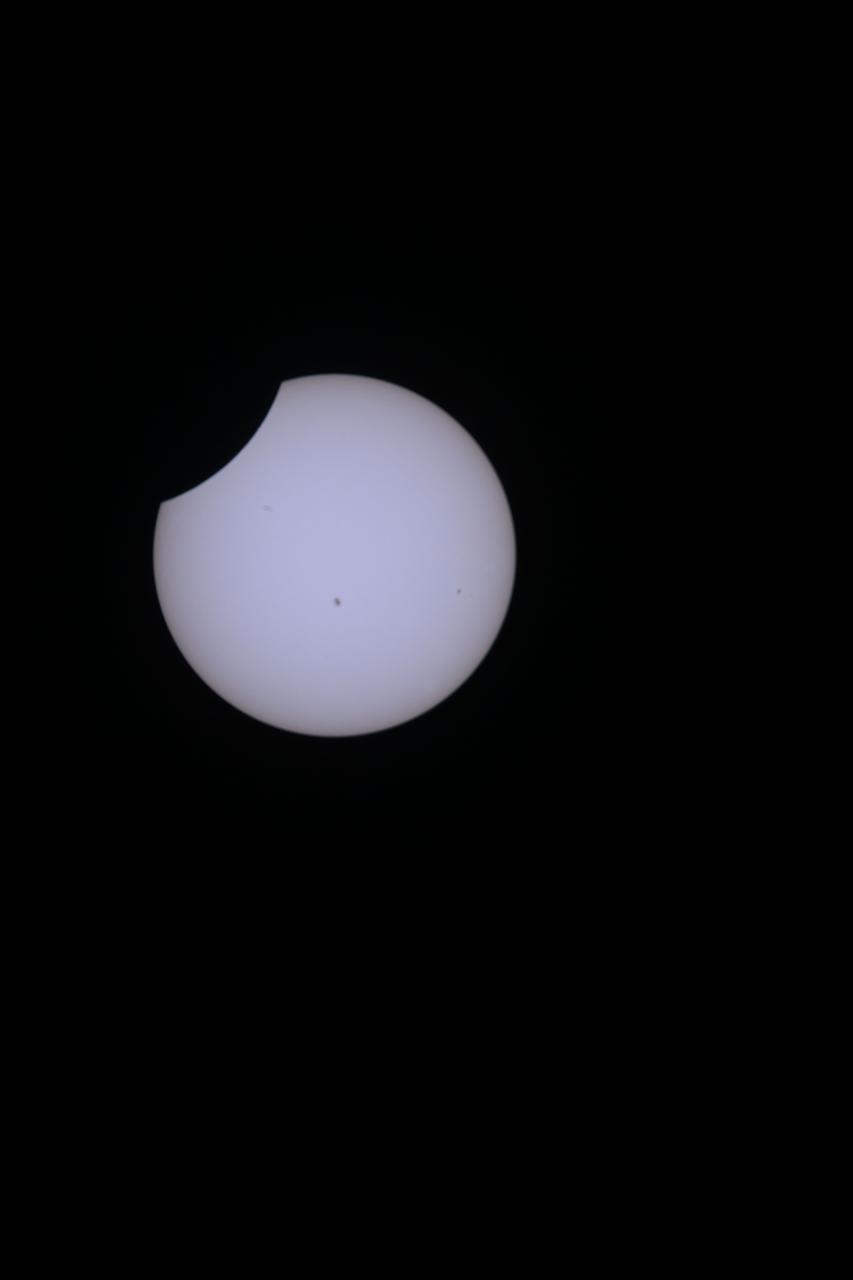 iss071e001435 (April 8, 2024) -- As the International Space Station orbited 257 miles above Earth, NASA astronaut and Expedition 71 Flight Engineer Matthew Dominick captured a still image of the 2024 solar eclipse from the unique vantage point of the orbiting laboratory,