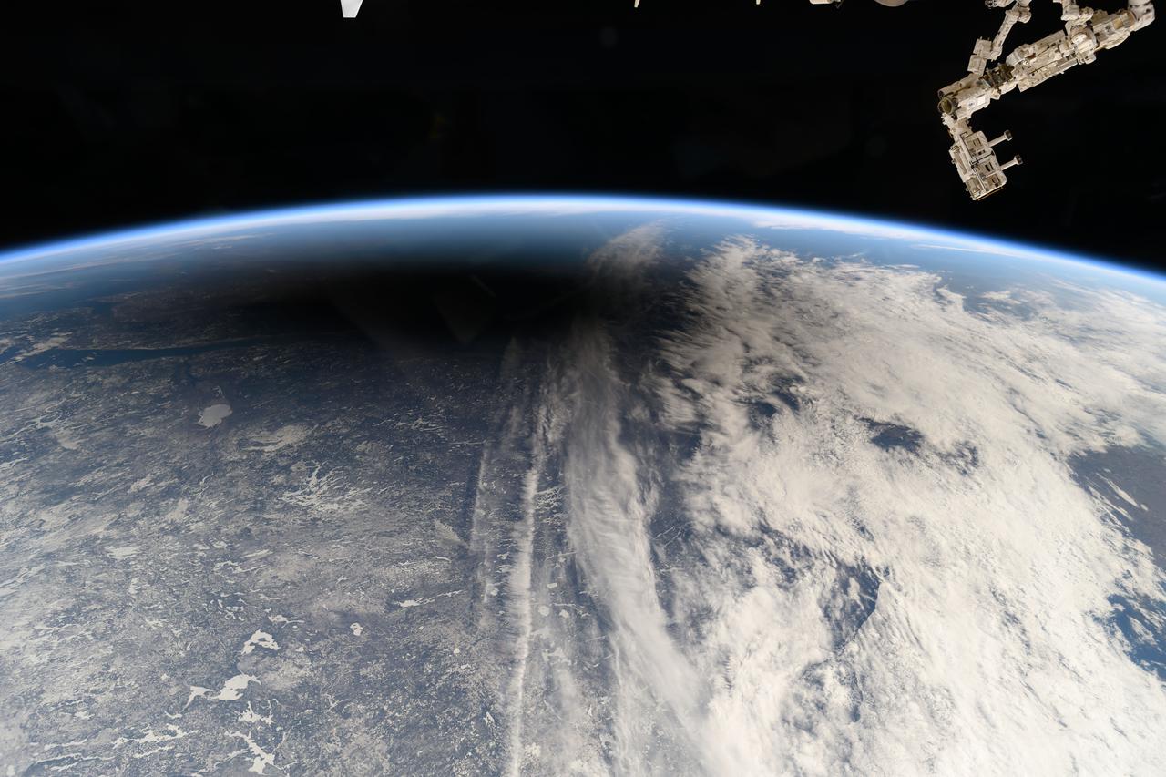 iss071e002836 (April 8, 2024) --- The Moon's shadow, or umbra, is pictured covering portions of the Canadian provinces of Quebec and New Brunswick and the American state of Maine in this photograph from the International Space Station as it soared into the solar eclipse from 261 miles above.
